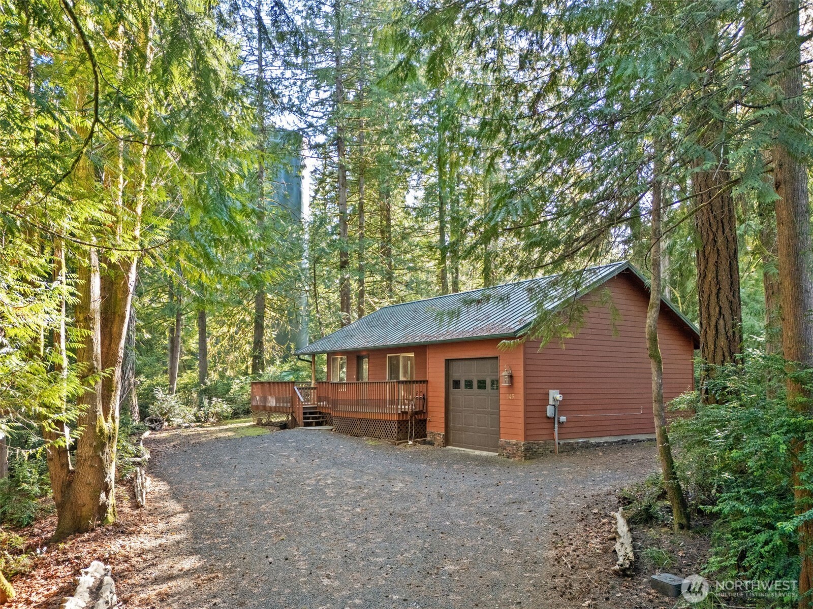 Well maintained and appointed cabin in the woods at Hartstene Pointe's quiet gated beach community.  The perfect place to enjoy the peaceful serenity of our wooded areas, boating on South Puget Sound, or watching the wildlife.  Light and bright w/lots of windows and skylights.  Easy care LVP floors in most rooms.  Kitchen w/granite counters, eating island, lots of storage and natural light next to dining area.  Primary bedroom w/larage slider to partial wrap deck.  Second bedroom/office has half bath/wall fireplace.  Large bathroom with laundry.  Living/dining area has large slider to new partial wrap deck/dog run.  Hardiplank siding/metal roof. Small garage/shop/storage.  Enjoy all HP  amenities: pool, clubhouse,fitness center, tennis/sport courts, marina/ramp, picnic/firepit/areas, miles of walking trails & saltwater beaches.