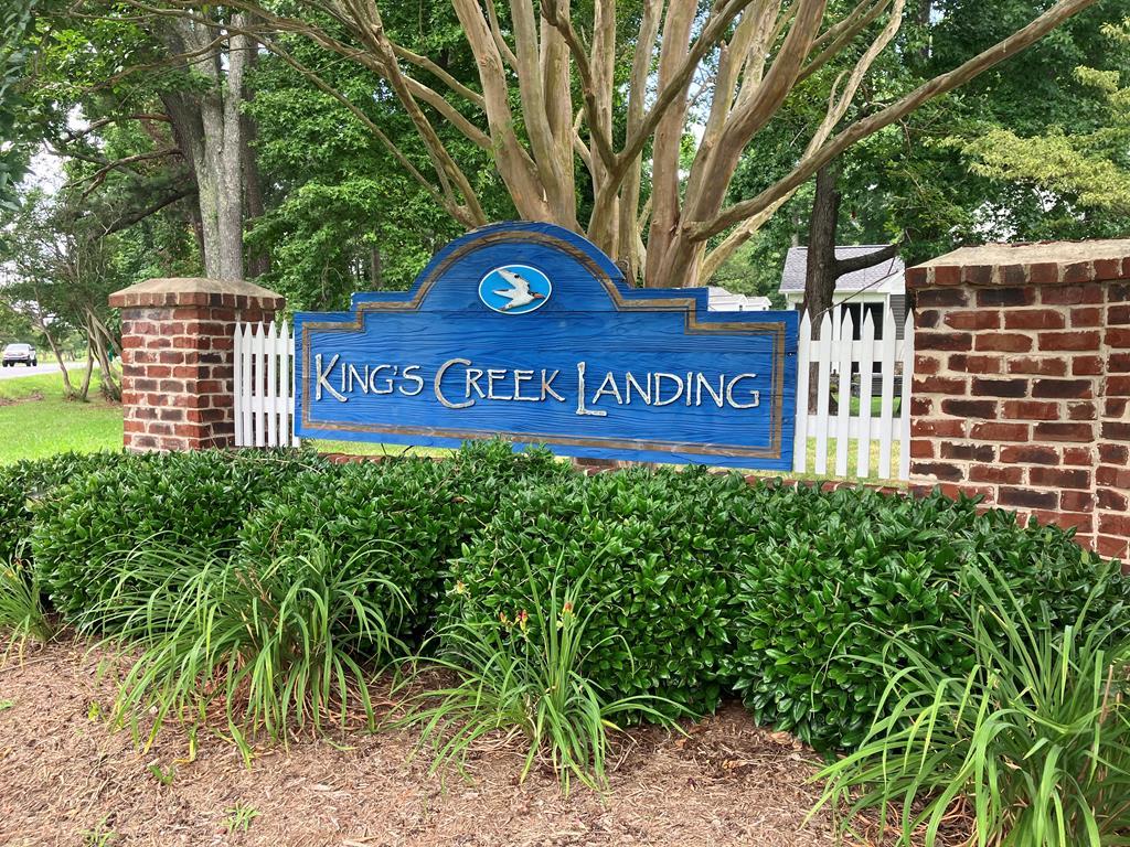 GREAT OPPORTUNITY TO BUILD YOUR COASTAL HOME ON THIS LARGE OPEN 4 BEDROOM HOME-SITE JUST OUTSIDE OF CAPE CHARLES. Located just minutes to the Historic Beachfront town of Cape Charles. Kings Creek Landing offers a community swimming pool, tennis courts and natural walking trails along the waterfront. Walk down to the docks and enjoy gorgeous sunsets over Kings Creek. Just minutes to the Cape Charles beach, shopping, casual & fine dining, town marina and harbor plus summer concerts on weekends in Cape Charles's central park. Enjoy all of the historic town amenities without having to pay town's additional taxes. Well/Septic Cert letter on file for a 4 bedroom home.