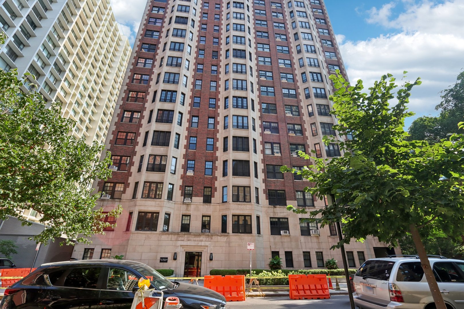 The Eddystone, located at 421 W Melrose Street. Constructed in 1929 and housing 77 distinguished condominiums across 21 stately stories. Upon entering off the private elevator, you are greeted by a graceful foyer with original ceiling arches. Ascend two steps up into a double living room that serves as the heart of this 3400+ sq ft home, featuring a hand-carved, finely detailed original marble fireplace that stands as a masterpiece of artisanal craftsmanship. Solid oak floors, set in a beautiful parquet and herringbone pattern, span the entirety of the home. Natural light floods the space through a series of elegant French swinging windows-gracing both the living room and Dining room. For those seeking functionality, the home offers an optional library or flexible office space adjacent to the living room. Culinary enthusiasts will delight in the expansive kitchen with an adjoining large eat in area, with its ample storage. The primary ensuite bedroom is a sanctuary of relaxation, featuring a cozy sitting area, and panoramic views of the western horizon and  Lake Michigan. Two additional spacious bedrooms, complemented by a total of three full bathrooms. The 4th bedroom is being used as a small TV room off the Primary bedroom.  Residents also enjoy thoughtful amenities. A recently added rooftop deck and a  refreshed laundry and workout facilities. A dedicated 24-hour door person and on-site part-time management & security. One block off the  sparkling lakefront along with the vibrant charm of East Lakeview's premier shops and dining. This remarkable listing offers a residence with architectural integrity and an unbeatable urban location.
