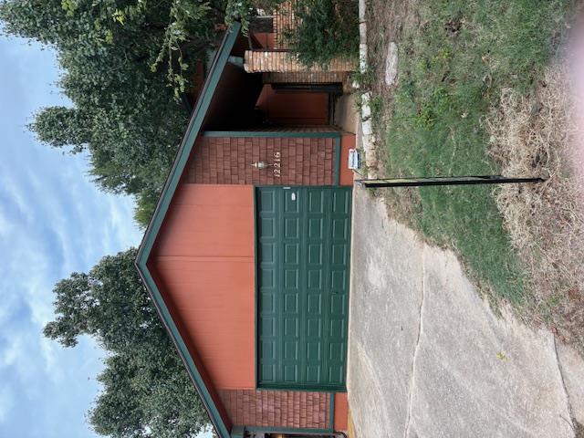 Beautiful well maintained home featuring 2 beds and 1 bath upstairs and primary bed and bath downstairs with walk-in closet. Ceiling fans in all bedrooms, living and kitchen. Living area with fireplace (gas logs but easily converted back to wood burning). New carpet in living area.  Kitchen has an eating area and a pass through to formal dining/living area. Washer/Dryer/Fridge all stay with home. You will love relaxing on the private backyard patio surrounded with refreshed landscaping and a new fence. The T-111 siding replaced and new painted exterior.  Refreshed landscape also down the side of the home from the gate. Walking trails and access to 3 pools. Close to major highways, shopping and Mercy Hospital. Make this move in ready property your next home!