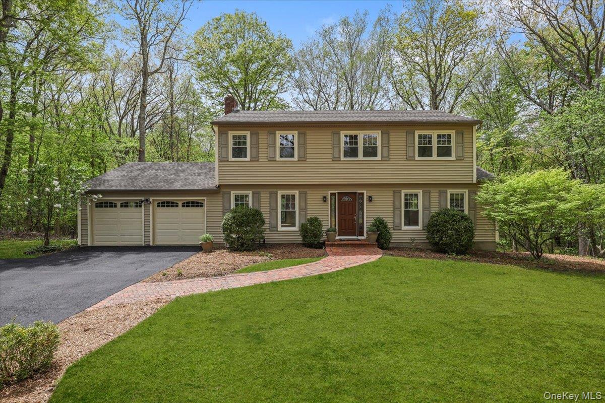 THE ONE YOU HAVE BEEN WAITING FOR! Move-in ready and surrounded by nature, this beautifully updated Colonial is tucked away on a quiet cul-de-sac. Enjoy a peaceful setting that's ideal for morning coffee on the deck, scenic dog walks, and neighborhood bike rides, while still offering a highly convenient location close to shopping, schools, parks, and commuting routes.From the moment you arrive, you'll appreciate the care and investment throughout, including NEW HARDWOOD FLOORS, A RENOVATED EAT-IN KITCHEN with a coffee bar and NEW APPLIANCES, NEW HARDWOOD FLOORS, UPDATED BATHROOMS, and BRAND-NEW CENTRAL AIR CONDITIONING AND HVAC.Designed for comfortable everyday living and effortless entertaining, the main level features a spacious family room with a classic WOOD-BURNING BRICK FIREPLACE and sliding glass doors to the deck, creating a seamless connection to the outdoors. A formal dining room and an elegant living room with French doors provide flexible spaces for gatherings, holidays, or a home office.Upstairs are four bedrooms, including a primary suite featuring a walk-in closet with a custom organization system and a beautifully renovated ensuite bath.The finished lower level expands your living space with endless possibilities for a recreation room, fitness area, playroom, or media room. An oversized two-car garage, abundant closet space, and an attic provide exceptional storage.Every major improvement has already been completed — simply move in and start enjoying a home that combines modern comfort, natural beauty, and everyday convenience.