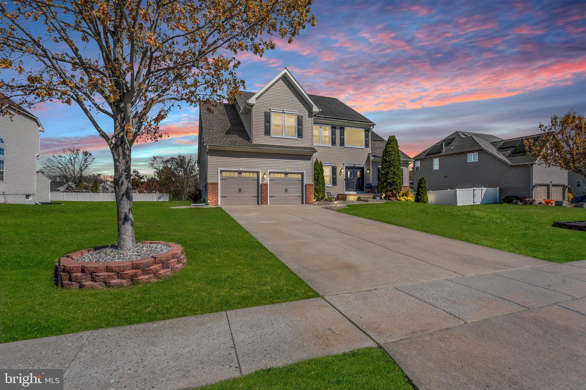 Welcome to what pure pride in ownership  looks like as you step into a home that immediately stands out for its space, thoughtful layout, and attention to detail. A beautiful two-story foyer with hardwood flooring and an open staircase creates a strong first impression and sets the tone for this expansive residence.The main level is designed for both everyday comfort and effortless entertaining. You’ll find a dedicated home office, powder room, and defined yet connected living and dining spaces with architectural detail. The kitchen features a center island, abundant cabinetry, and opens directly to the family room—creating a natural gathering space. The family room is highlighted by soaring vaulted ceilings, updated flooring, and a convenient back staircase. A first-floor laundry room adds to the home’s functionality.Upstairs, four generously sized bedrooms offer plenty of room to spread out, along with two full bathrooms. The primary suite delivers the space buyers are looking for, complete with a walk-in closet, a separate sitting area, and a spacious en-suite bath.Out back, the setting truly shines. A beautifully crafted Trex deck overlooks a peaceful wooded backdrop, complemented by well-maintained landscaping and a sprinkler system—perfect for relaxing or entertaining outdoors.Major upgrades have already been completed, including a new roof (2024), new garage doors (2025), and all flooring and carpeting updated in 2020. The home also features all new energy-efficient windows that have already been installed. Additionally, the solar panels are financed and will be paid off at closing, allowing the new owner to enjoy the benefits of a fully owned solar system from day one.This is a large, impressive home where care, updates, and attention to detail are evident at every turn—offering a true move-in ready opportunity with space, style, and long-term value.