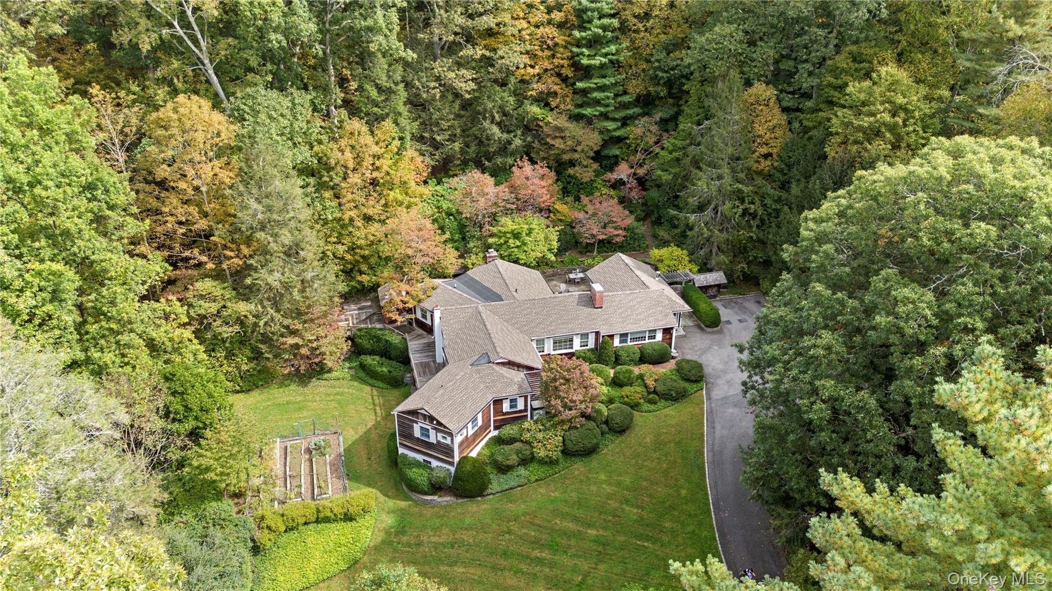 Charming Bedford Retreat with a Storied Past. Set among lush, beautifully landscaped grounds just outside the heart of Bedford, this inviting 3 bedroom, 2.5 bath residence offers the perfect blend of comfort, character and history. The sprawling one level layout strives to embrace all that the scenery has to offer with many of its rooms opening directly to either the flagstone patio or walkway to the back deck. A private, gated driveway leads to an expertly sited property surrounded by mature trees, meandering paths, and an atmosphere of serene privacy. The grounds evoke a sense of history and culture — a fitting backdrop for a home most recently owned by the daughter of world-renowned opera legend, Beverly Sills.  The owner is also the great granddaughter of James C. Fargo, founder of American Express Travelers Checks and a descendent of Mayflower passengers John Alden and Priscilla Mullins.
Located within the sought-after Bedford Central School District, with convenient access to major highways and Metro North Train Station. Just moments from Bedford’s charming Village Green, this residence offers the rare combination of peaceful seclusion and access to shopping, dining, and all that Bedford has to offer.
Professional interior photos scheduled 10/10/25.