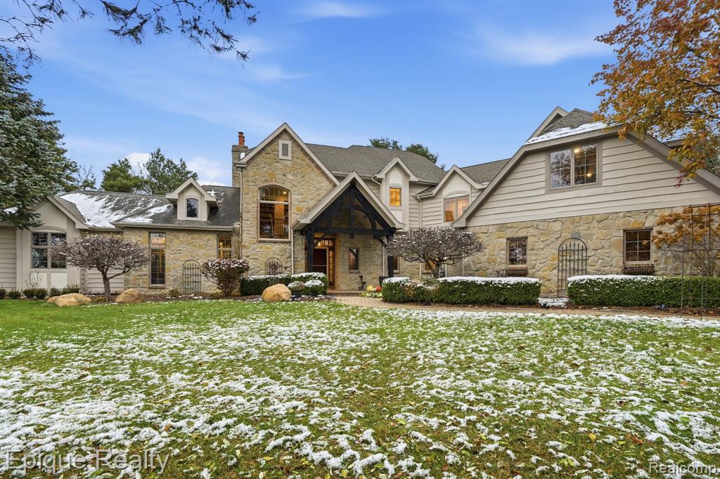 Welcome to Horse Country! Hidden near the end of a quiet country lane, this remarkable estate offers the kind of privacy, serenity, and architectural romance rarely found outside the French countryside. Set on 10 rolling, wooded acres with exclusive ownership of the picturesque pond just across the lane this property delivers a lifestyle that feels worlds away, yet remains just minutes from Metamora’s charming downtown village. Experience true French Country elegance at “Le Mas.” From the moment you step into the grand foyer, you’ll be captivated by the unmatched character and craftsmanship of this custom-built home. The estate features reclaimed French terra cotta tile from a barn in France, custom hand-sewn Canadian timber beams, and a breathtaking natural limestone fireplace that anchors the great room. The stately main-floor primary suite includes a gas fireplace, private deck, spa bath, and dual custom walk-in closets. A chef-ready kitchen impresses with glazed maple cabinetry and designer appliances, including double ovens and a warming drawer. This showstopper kitchen opens to the dining room, great room, deck, and enclosed screened porch perfect for entertaining. Main-floor laundry adds everyday convenience. Upstairs offers two spacious bedrooms and a full bath, while a second staircase leads to a massive bonus room with a full bath ideal as a 4th or 5th bedroom, studio, or private retreat. The sprawling walkout lower level provides an additional 2,500+ square feet, featuring a continuation of the striking limestone fireplace, and is plumbed for a future full bath. Additional highlights include a 4-car garage, Andersen casement windows, geothermal heating, Generac generator, central vac, steel gutters, and low-maintenance landscaping. A rare opportunity to own a secluded, architecturally significant estate that has been freshly updated. Only two owners since built. Located in Dryden Schools and close to M-24 and I-69. Home may be under surveillance. BATVAI.