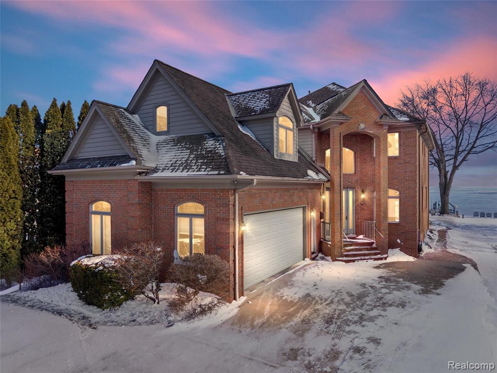Experience luxury lakefront living in this one-of-a-kind custom-built home on Lake St. Clair, where no expense was spared and timeless craftsmanship shines. Offering 4 bedrooms, 3 full baths, and 3 half baths, this exceptional residence features soaring ceilings in the great room and foyer, along with expansive lake views from most rooms. The main level is designed for comfort and entertaining, with a chef’s eat-in kitchen, first-floor laundry, private office, and cozy den with stunning water views that can be closed for added privacy.Upstairs, the incredible second-level primary suite is a true retreat with two walk-in closets, an oversized shower, jetted tub, and private covered balcony overlooking the lake. Two additional bedrooms share a full bath on the second floor, along with a workout room and ample storage. The third-floor bedroom/hangout is perfect for guests or kids, offering panoramic lake views plus a large clean attic for more storage.The fully finished basement is an entertainer’s dream with a full pub, movie theatre, game room, fireplace, projection screen, and unique features including a powered pool table light that raises for table tennis, plus a convenient powder room. Basement access is available from both the home and attached heated garage.Outside, enjoy a detached heated second garage with half bath and finished loft space above, a whole-house generator, sprinkler system, outdoor shower, tiki bar, and updated boat hoist for at least a 40-foot boat, plus two newly installed jet ski/dinghy lifts. Deep water makes boating effortless, even in low-water years.With too many custom upgrades and features to list, this home is a must-see for anyone seeking luxury lake living. Just north of St. Clair Shores with lower township taxes, currently non-homestead. Ideally located near waterfront restaurants, bars, and shops accessible by land or sea—this is a rare Lake St. Clair gem built to last.