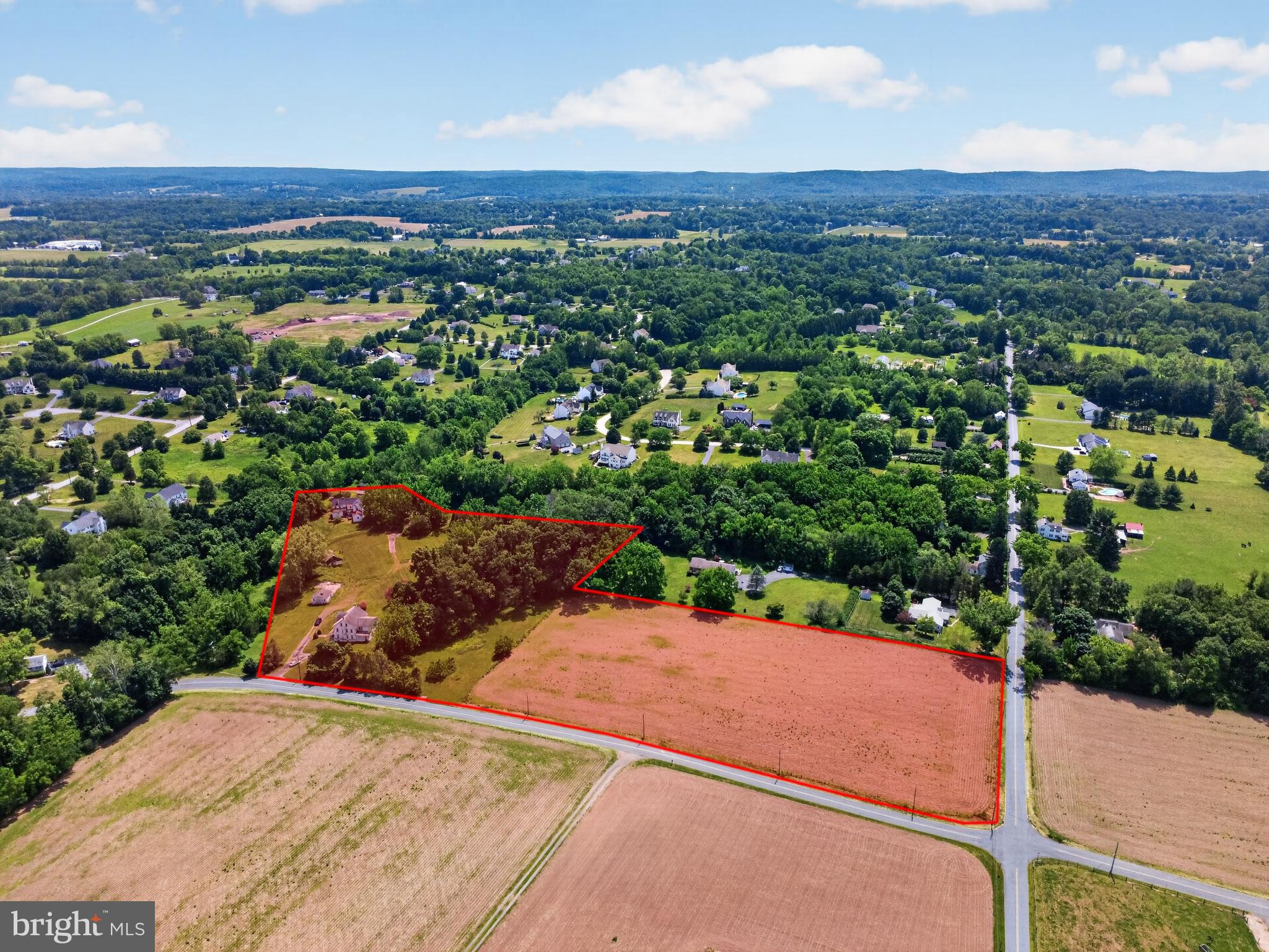 Exceptional opportunity to own 9.8 acres of mostly cleared, usable land in East Coventry Township, served by the highly regarded Owen J. Roberts School District. Stretching from Kolb Road to Baptist Church Road, this unique property offers tremendous potential for equestrians, investors, builders, and those seeking a private country estate. The existing improvements include a large duplex in need of significant renovation, making this primarily a land-value opportunity. Built in the 1890’s the bones of the duplex consist of 16-inch stone walls & each side features a living room, dining room, and kitchen on the main level, three bedrooms and a hall bath on the second floor, plus two additional bedrooms on the third floor. Both units also have full basements. The duplex could potentially be restored, maintained as an income-producing property, or converted into a single-family residence, subject to buyer's vision and any required approvals. A barn is also located on the property and is currently in need of dire repair. With nearly 10 cleared acres, the land is ideally suited for horses and could be transformed into a horse farm, equestrian property, hobby farm, or private estate. According to discussions with East Coventry Township, the property may have subdivision potential, subject to township review and approvals. Buyers may wish to explore the possibility of creating additional building lots and constructing new homes while retaining the existing residence, offering exciting development and investment possibilities. The property's unique layout, extending from Kolb Road to Baptist Church Road, may provide additional flexibility for future planning and use. Whether you're looking for a special equestrian property, a renovation project with acreage, a private estate setting, or a property with potential development opportunities, this offering presents a rare chance to acquire nearly 10 acres in a desirable Chester County location. Seller had a survey done and is available online. Through Seller’s research, the property is subdividable with up to 4 lots…upon plot plan approvals. Buyer is responsible for conducting their own due diligence regarding subdivision, zoning, permitted uses, development potential, and all township requirements.