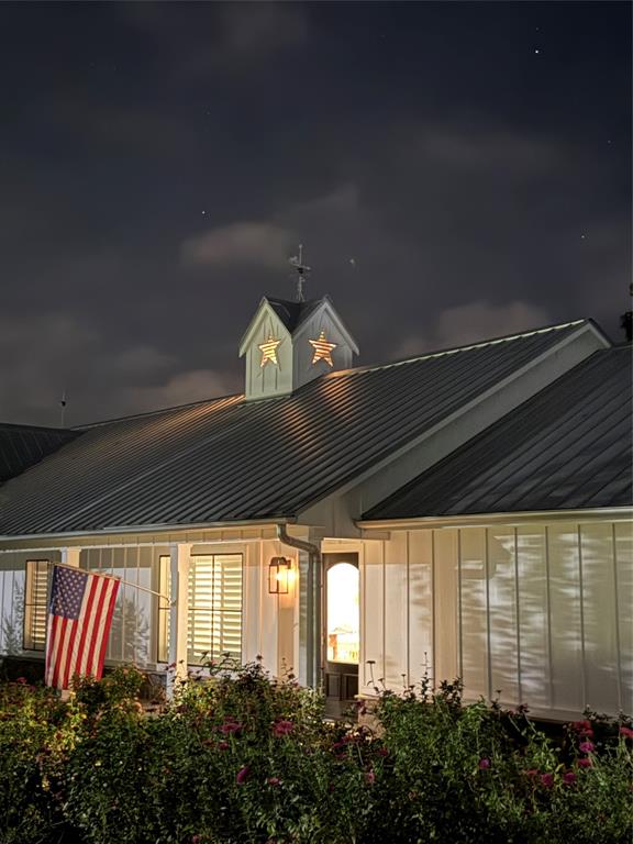 A collector's dream comes true with this farmhouse chic 2,756 square foot home, on 16-plus acres, with custom touches and tastefully hand-picked antique finishes! From the elegant 1860's Georgia wood floors and antique Chicago pavers, walk into this handsome home and be astounded by the thoughtful interior decorating that elevates the space. Barn beams from the 1840's give the vaulted ceilings a nice pop of warmth in the living room, kitchen, and dining areas. Skylights, white slat ceilings, and recessed lights also brighten up the great room. A generous kitchen includes a commercial gas range, warming tray with heat lamps, commercial vent, farm sink, dishwasher, separate ice maker by the pantry, and custom lights. The walk-in pantry comes with an antique door. The primary ensuite bedroom will impress with a spa-like bathroom that has a luxurious interior with a separate tiled shower, soaking tub, and separate double sinks. Guests will enjoy the spare bedroom with a modern hall bathroom with a tiled walk-in shower. A second living space will make the perfect family room or can be turned into a bedroom. Additional touches include custom-made Gothic window, Kohler faucets, plantation blinds from Custom Shutters, GE monogram appliances, restoration hardware vanities with solid surface Caesar Stone tops, handmade walnut doors, and handmade cupola. Sit on the oversized 1,009 square-foot deck and appreciate the mature trees that were planted in the fall of 2024. Parking is a breeze with a concrete drive and 600 square-foot garage. This house also comes with Prierfert Ponderosa fencing, spray foam in the attic and pier and beam areas, and large scenic pond. This spectacular place provides lots of curb appeal, including Copper Bevolo gas lanterns from New Orleans--all with acreage close to town. Don't let the 1940 year built fool you. The original home was re-built and 1500 feet added by a true craftsman, master carpenter!