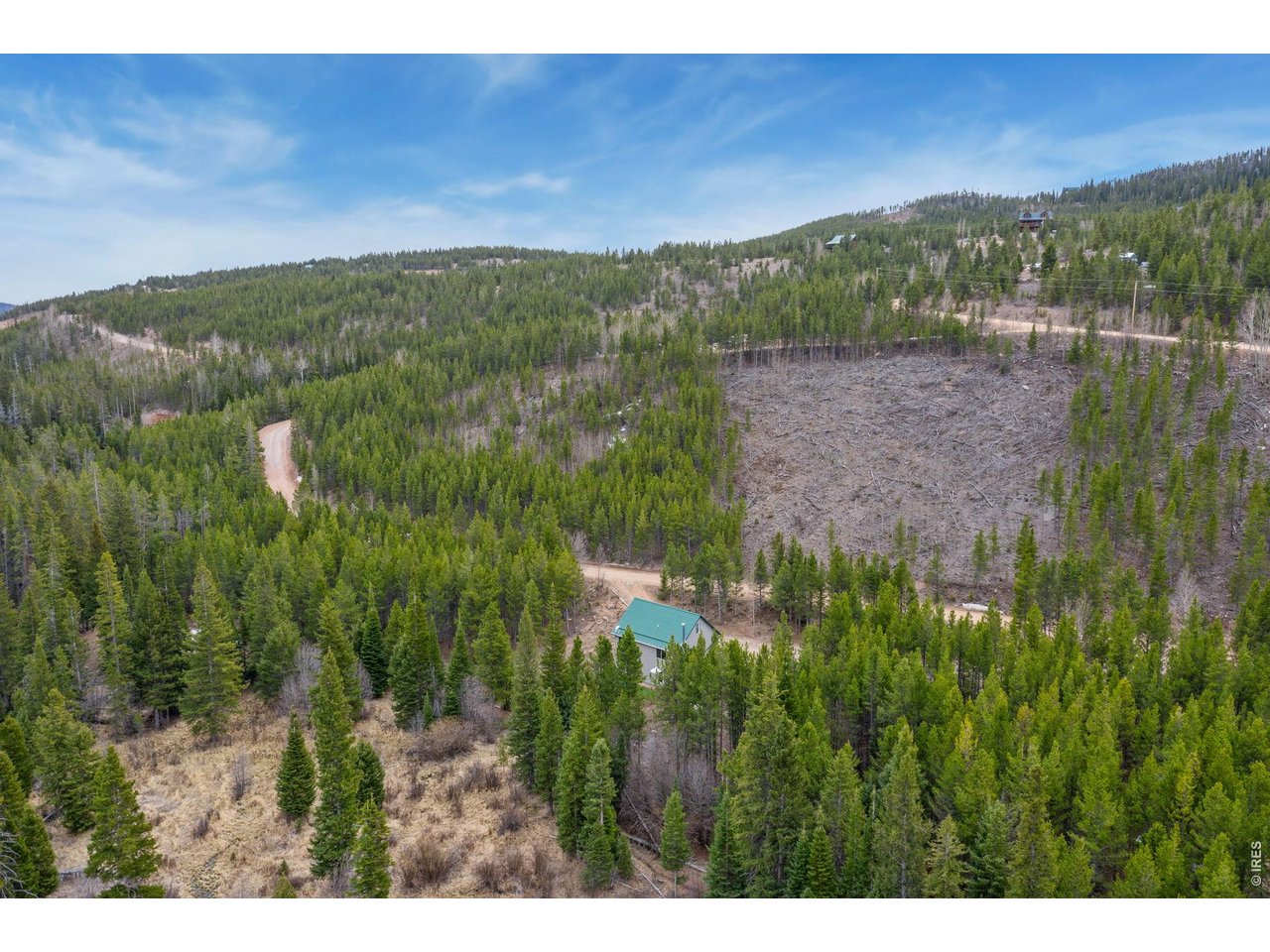 This incredibly private turn-key cabin backs AND fronts to open space! It is tucked toward the back of Crystal Lakes in a very quiet part of the community. Head out the back door to open space, Panhandle Creek, Otter Pond, and a community trail. Don't forget your fishing pole! Or head out the front door and enjoy the open space that connects to National Forest for endless hiking opportunities. Inside you will find a well-maintained 4-bedroom home loaded with charm. This cabin has had many upgrades recently added to include new flooring, appliances, water heater, plumbing & electrical updates, light fixtures, entry doors, gutters, new porch, newly graveled driveway, and more. For peace of mind there is a nearly new Generac generator that comes on automatically in an outage. Don't miss the 300 square foot finished sleeping loft with room for guests to bunk! Walk-out basement with plenty of light. Easy access- not far off of Ottawa Way, and with a fairly level, through driveway, you can enjoy this property year-round. Spacious storage shed and well mitigated for fire prevention. Crystal Lakes neighborhood offers private fishing, stocked ponds, private hiking, and more. Don't miss this stellar opportunity for a private getaway with room for everyone!