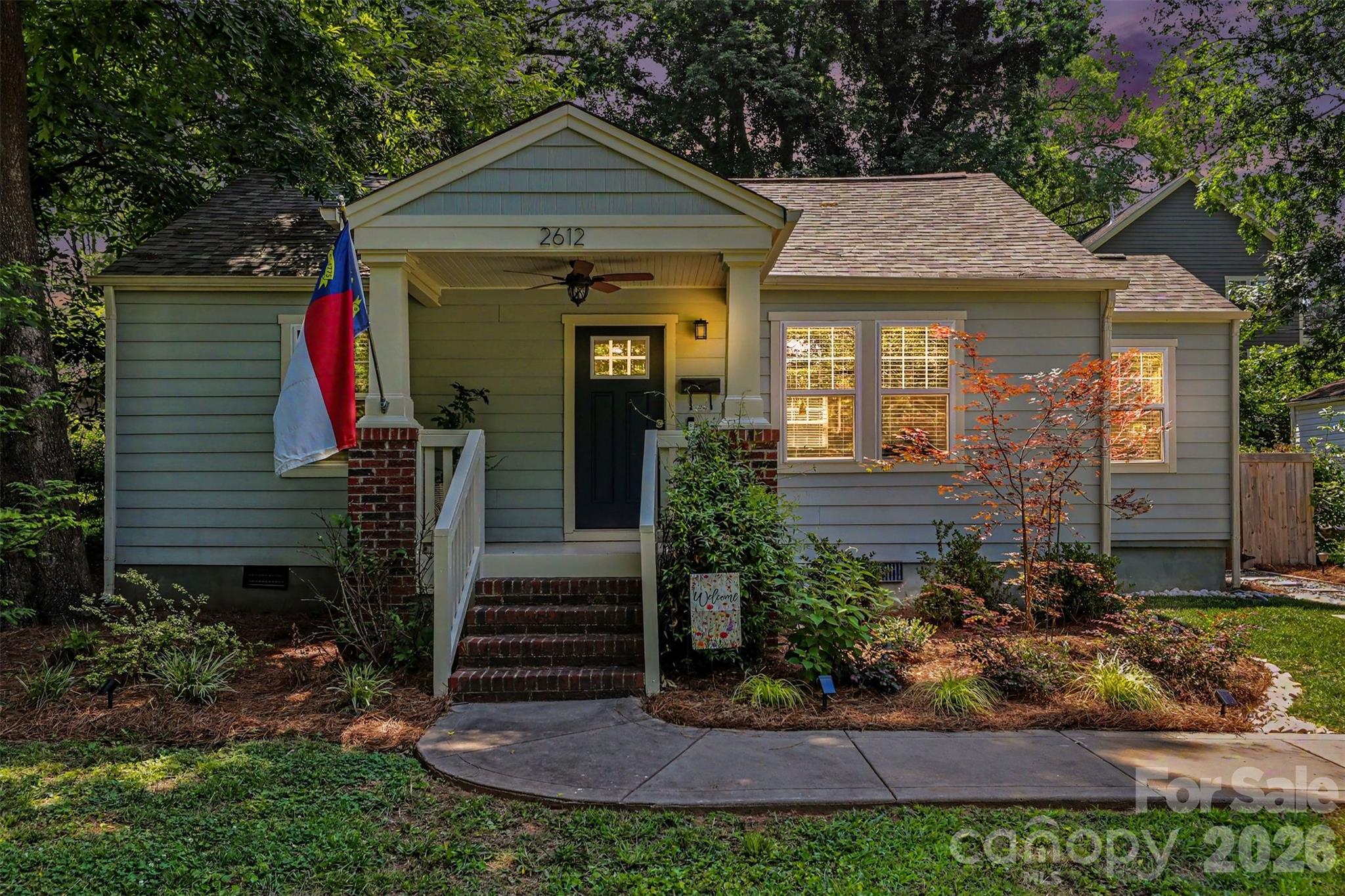 Charming, updated, and in the middle of one of Charlotte's most exciting areas, this move-in ready cottage is one you won't want to miss. Located in Historic Smallwood, just minutes from Uptown, Wesley Heights, and Biddleville, this beautifully renovated 2-bedroom, 1-bath home blends original character with thoughtful updates throughout.Step onto the welcoming covered front porch and into a bright, open living space featuring gorgeous original hardwood floors. The updated kitchen offers stainless steel appliances, neutral cabinetry, and a dedicated laundry area for added convenience. Major improvements including fiber cement siding, NEW architectural shingle roof, and energy-efficient insulated windows provide peace of mind for years to come.Outside, you'll find a fully fenced backyard that's perfect for entertaining, gardening, pets, or simply enjoying a quiet evening at home. A concrete driveway provides off-street parking for two vehicles.The location truly sets this home apart. Enjoy being just minutes from Uptown Charlotte and within walking distance to the future Savona Mill Food Hall and the Stewart Creek Greenway. Whether you're grabbing dinner, meeting friends for a drink, hopping on the greenway for a walk or bike ride, or taking advantage of everything West Charlotte's revitalization has to offer, you'll love the lifestyle this location provides.Don't miss your chance to own a piece of one of Charlotte's fastest-growing neighborhoods.