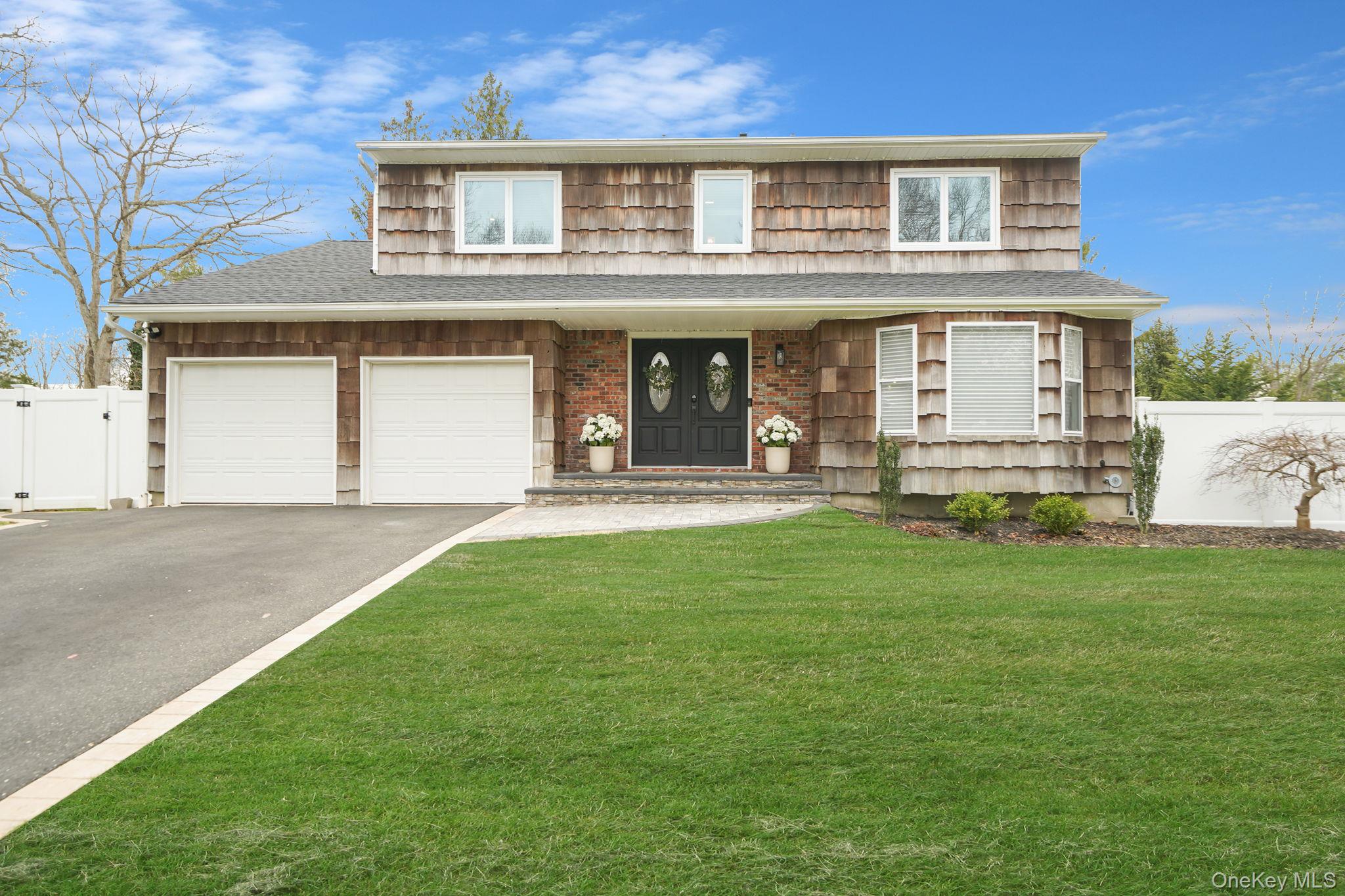 ENTERTAINER’S DREAM IN PRIME NESCONSET LOCATION! Welcome to this beautifully renovated and meticulously maintained 4 bedroom, 3.5 bathroom home situated on a corner lot on a quiet dead end street. This property offers the perfect combination of luxury, comfort, and functionality.The backyard is designed for entertaining featuring a saltwater in-ground heated pool surrounded by Cambridge pavers,  a stone fire pit area, outdoor shower, outdoor bathroom, and a rare private putting green!!! The expansive yard offers multiple entertaining spaces and exceptional privacy.The interior features an open floor plan with a renovated kitchen with newer appliances, two fireplaces, spacious bedrooms, and a primary suite with vaulted ceilings, a large en-suite bathroom, and generous closet space.Major updates include a new roof, new oil tank, propane stove and fireplace and upgraded 200 amp electric service.Additional features include a 2 car garage with epoxy floors, pull down attic for storage, and a finished basement with a wet bar, kegerator, home gym area, and additional living space.Conveniently located near shopping, restaurants, parks, schools, and major transportation! Financed (not leased) solar panels to offset electrical expenses! A rare opportunity offering lifestyle, location, and move-in condition!!! This will not last!!!!