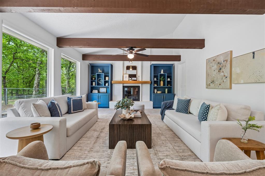 Tucked away on a wooded homesite of just over two acres in highly sought-after Deer Creek Schools, this beautifully updated 4-bedroom, 2.5-bath home offers the perfect blend of privacy, space, and convenience just minutes from Edmond’s shopping, dining, and everyday amenities.From the moment you step inside, you’re welcomed by charming brick tile flooring, modern paint tones, and a warm, inviting layout. The spacious living room is a true centerpiece, featuring a raised ceiling with exposed beams, a wood beam fireplace mantle, custom built-ins, and oversized picture windows that flood the space with natural light while showcasing serene backyard views. The living area flows seamlessly into a large dining space, ideal for gatherings and everyday living.The kitchen is both functional and stylish, tons of storage, stainless steel appliances, double ovens, a subway tile backsplash, and a stunning island with a natural wood top and additional storage. The refrigerator stays with the home. Just off the back porch, a thoughtfully designed mudroom provides built-in bench seating, cabinets, and extra storage.The private primary suite is a retreat of its own, highlighted by cathedral ceilings and beautiful natural light, along with access to a private porch. The en suite bathroom features dual vanities, a large walk-in closet, and an oversized walk-in shower with double shower heads.Secondary bedrooms are generously sized, and the hall bathroom includes dual vanities for added functionality. The laundry room is has a sink, work surface, and plenty of storage. Step outside to enjoy the large back porch overlooking peaceful, wooded acreage. Perfect for relaxing or entertaining. The 30x40 shop building with electric and 220 amp outlets offers incredible flexibility for hobbies, storage, or workspace.This is a rare opportunity to enjoy acreage living with modern updates and close proximity to everything Edmond has to offer.