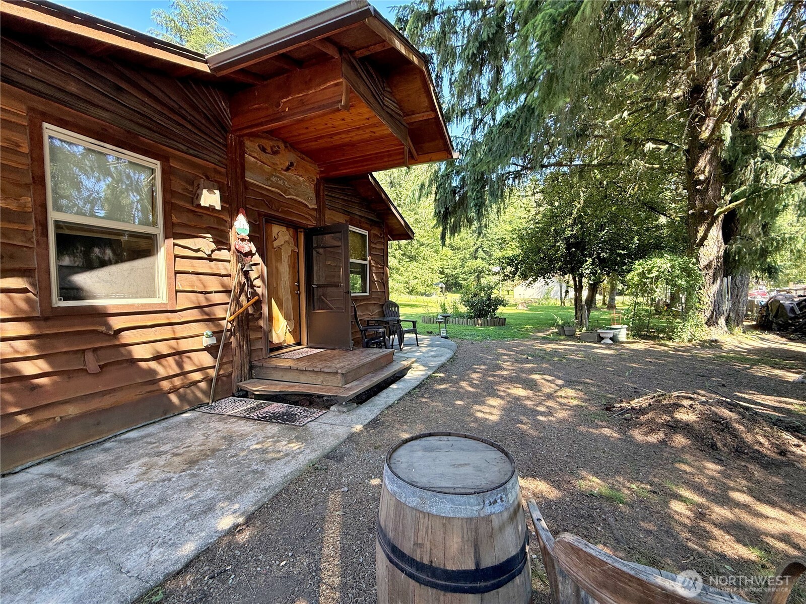 Cozy Custom Live Edge Cedar Cabin built by Randle Woods located in a place that feels like the country but within walking distance of shopping, 2 parks, post office, schools, and hospital. 25 minutes to Mt Rainier, an hour to White Pass Ski Resort or Mt. St. Helens. An oversized bedroom with a private door to the deck, a bonus room that can be used as a bedroom, and an ADA shower.  Lots of room for storage or tinkering in detached garage with carport and 10 x 20ft insulated storage shed with power and heat.  Fully fenced park-like backyard ready for gates of your choosing. Lots of sun for a garden, but plenty of shade trees also. Enjoy your coffee while watching the Mallards, who visit in the Spring. Year- round hummingbirds and migratory visitors.  Potential as an Airbnb for extra income.