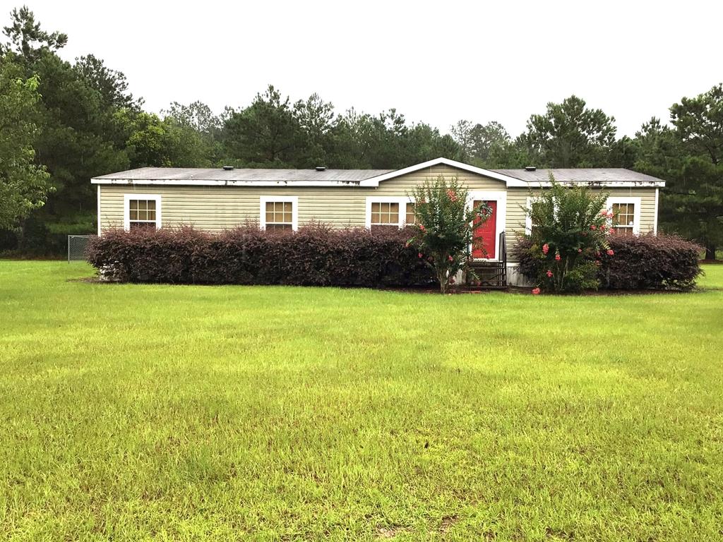 Spacious 2,048 sq ft mobile home situated on 8 beautiful acres, offering the perfect blend of comfort and country living. This 3-bedroom, 2-bath home features an open floor plan ideal for both everyday living and entertaining, with a generously sized master suite providing a private retreat. Enjoy the peace and quiet of a serene rural setting while still having plenty of room to roam, garden, or simply take in the surroundings. Approximately 3.3 acres are protected under a conservation easement, adding natural beauty and privacy. The backyard is enclosed with chain link fencing—perfect for pets or outdoor activities. If you're looking for space, tranquility, and a place to call home, this property delivers country living at its best. Can be purchased with 1333 and additional 16 acres for additional price.
