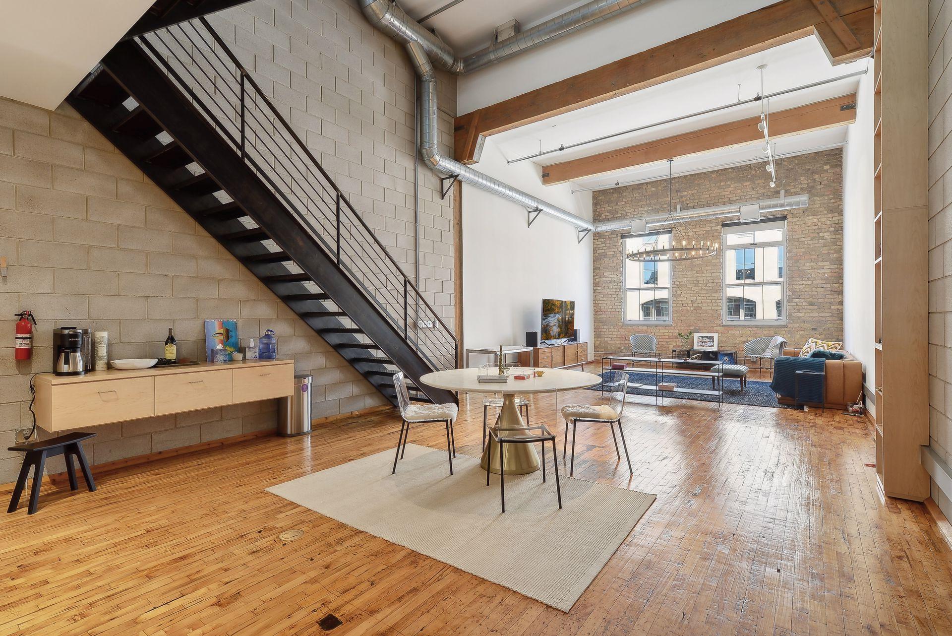 Step into style and elevate your everyday in this show-stopping New York-style condo, now available for rent in the heart of the North Loop! This 2-bedroom, 2-bathroom gem blends modern elegance with timeless character, offering a one-of-a-kind living experience. Soak up the city vibes or entertain under the stars on your own private rooftop terrace. Enjoy the convenience of two dedicated parking spaces and a private storage unit, along with water, sewer, and trash services all included in rent. Just outside your door, explore the best of the North Loop—trendy restaurants, chic boutiques, and buzzing local hotspots all within steps. This isn’t just a place to live—it’s a lifestyle.