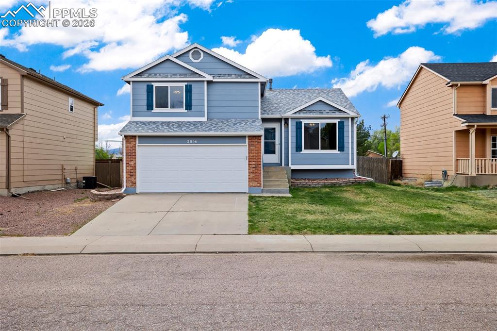 Move-in ready and thoughtfully updated, this 3-bedroom, 2-bath tri-level home offers comfort, functionality, and peace of mind with many major systems already replaced. Featuring luxury vinyl plank flooring throughout, the home welcomes you with a bright and airy living room highlighted by vaulted ceilings and abundant natural light. The kitchen and dining room combination is both practical and inviting, showcasing formica countertops, stainless steel appliances, and warm wood cabinetry—perfect for everyday living and entertaining. Upstairs, the primary suite includes a private ¾ en suite bathroom and a walk-in closet. Two additional bedrooms, a full bathroom, and a convenient linen closet complete the upper level. The lower-level family room offers a cozy retreat with walkout access to the fully fenced backyard—ideal for indoor-outdoor living. The backyard is a true highlight, featuring a beautiful, naturally emerging garden with poppies, pansies, lilacs, salvia, sunflowers, and marigolds. Just off the family room, you’ll find access to the attached 2-car garage for added convenience. The unfinished basement provides excellent potential to expand your living space or serves as ample storage. Enjoy added value with a newer roof (2024), along with NEW exterior paint and gutters, fresh interior paint, and a new garage door. Major systems have been updated for peace of mind, including a NEW furnace with attached humidifier, A/C, and water heater (2025). Ideally located with convenient access to schools, local amenities, and Fort Carson, this home is a fantastic opportunity you won’t want to miss!