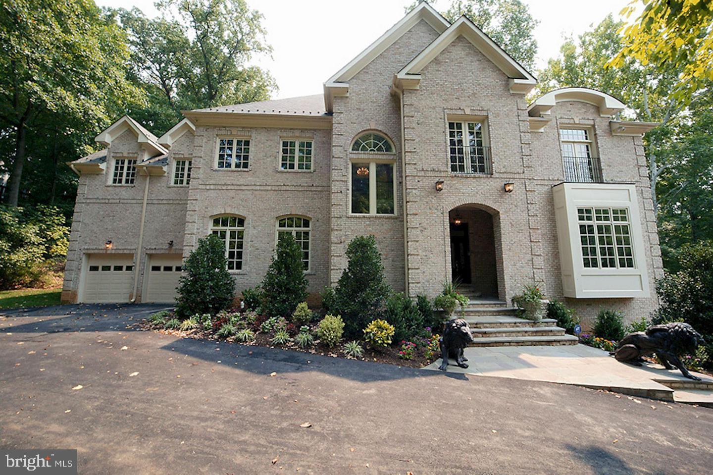 CALL for OFFERS:  Due October 1, 2025j 12:00 midnight Written Contracts with Proof of Funds email to dan with Contract in the Subject line.A rare estate of architectural distinction in an irreplaceable setting.Nestled within the exclusive Kirby Woods enclave of McLean, just 1.3 miles from Washington, DC via historic Chain Bridge, this grand residence offers extraordinary value, privacy, and presence. Set on nearly an acre of organically cultivated grounds with a serene creek meandering along its southern border, Maison D’Artagnan is a timeless tribute to scale and craftsmanship rarely seen today.Constructed entirely of tumbled brick on all four sides, the home rises nearly 80 feet—well beyond the limits of today’s height restrictions in both Fairfax and Arlington Counties—giving it soaring proportions and breathtaking interiors. Brazilian Cherry hardwood flooring runs throughout the main level, complemented by 13-foot ceilings, coffered and trayed architectural details, archways, and rotundas. Every room is generously scaled for entertaining and refined living.A chef’s kitchen, formal and informal living areas, four fireplaces, sauna, steam bath, and wraparound decks offer abundant space to relax and impress. Upstairs, multiple en-suite bedrooms and a palatial primary suite enjoy forest views. The walkout lower level includes expansive recreation spaces, guest quarters, and rough-in for an elevator (shaft and wiring complete).Enjoy 133 feet of private creek frontage, majestic 300-year-old sycamores, and complete seclusion—without HOA restrictions. The estate’s newer 50-year architectural roof with copper bays, flashing, and valleys (installed in 2025, warranty included) adds further longevity and peace of mind.This is a one-of-a-kind opportunity to own a grand residence that could never be built again under current zoning laws. Buyer interest incentives and rate buydown options available. Please inquire for private tour or additional confidential features not listed publicly.