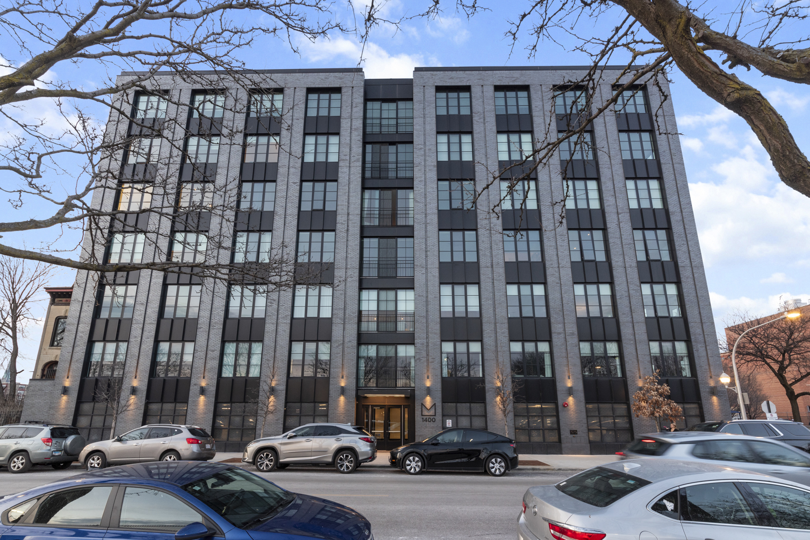Newer construction in the heart of the West Loop-welcome to 1400 W Monroe, a boutique collection of sophisticated 2-bedroom designer homes. Perfectly situated on Skinner Park, just two blocks from the acclaimed Skinner School and next to 569 Bark Park, this residence offers elevated urban living in one of Chicago's most sought-after neighborhoods.    This south-facing 2BR/2BA home features a thoughtful split floor plan with soaring ceilings, expansive loft-style windows, and unobstructed park views that fill the space with natural light.    The open-concept living area is anchored by a chef's kitchen designed for both beauty and functionality. Highlights include:    Custom Italian cabinetry by Linea Decor    High-end paneled Thermador appliances    Quartz countertops with an oversized waterfall island (seating for four)    Ample storage and sleek modern finishes    Perfect for entertaining, the space flows seamlessly into the bright living and dining areas. Electronic blinds add convenience and style, while interiors curated by NY-based Mojo Stumer bring a new level of sophistication to the West Loop.    The home has been meticulously upgraded throughout with designer-selected details that balance elegance and everyday functionality.  Additional features include: Garage parking available, Private storage unit included. A rare opportunity to own a turnkey designer home with timeless modern style-steps from everything the West Loop has to offer.
