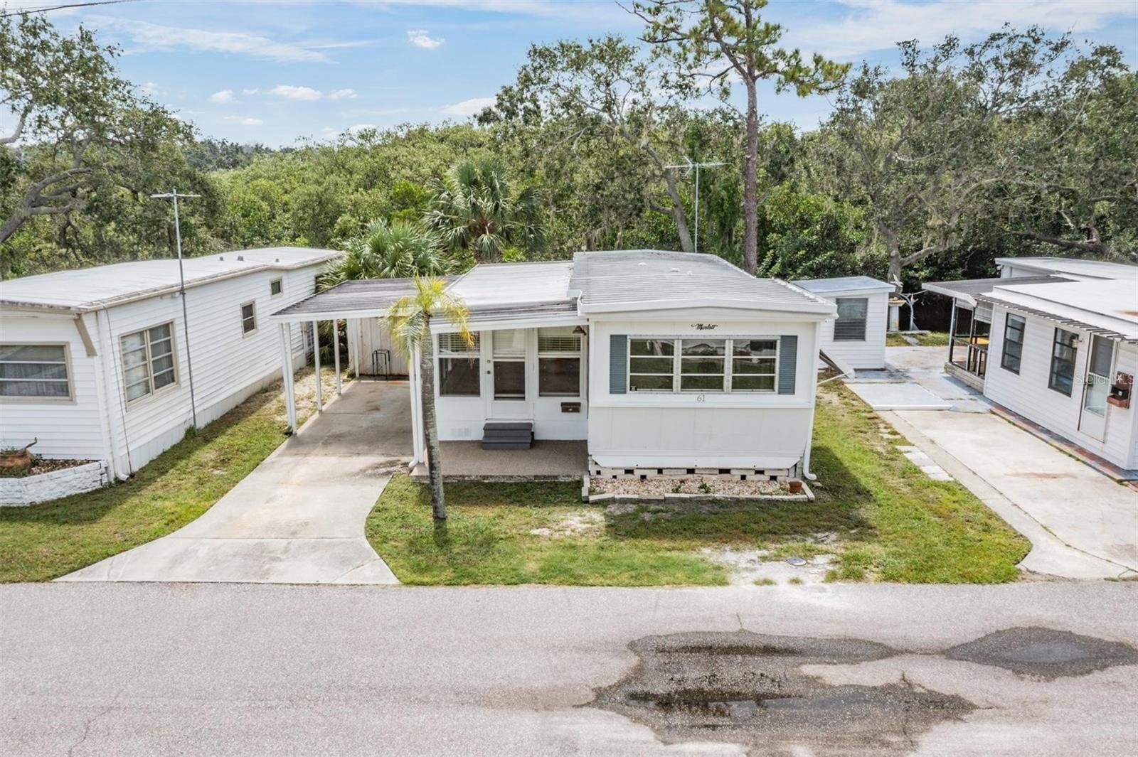Discover your slice of paradise on Cedar Creek! Imagine casting a line from your backyard or setting off in your kayak to explore the water just steps from your door. This home is perfectly situated in the heart of Dunedin, giving you unbeatable access to everything it has to offer. Just a two-minute stroll takes you to the Pinellas Trail, ideal for biking, walking, or jogging under the Florida sun. Around the corner, the Dunedin Community Center offers activities for every interest, while Hammock Park provides a peaceful natural retreat. Within five minutes, you can be in vibrant Downtown Dunedin with its boutique shops, dining, and entertainment. When the beach calls, the Dunedin Causeway and Honeymoon Island are just a short drive away. This 55+ community ensures a lifestyle full of connection and convenience. One resident must be at least 55, and a second may be 45+. The recreational building is a hub of activity, featuring offices, meeting rooms, game and card rooms, and a library all with air conditioning and Wi-Fi. You'll also find a workshop, laundry facilities, and versatile spaces for hobbies and gatherings. This property is being sold for land value.