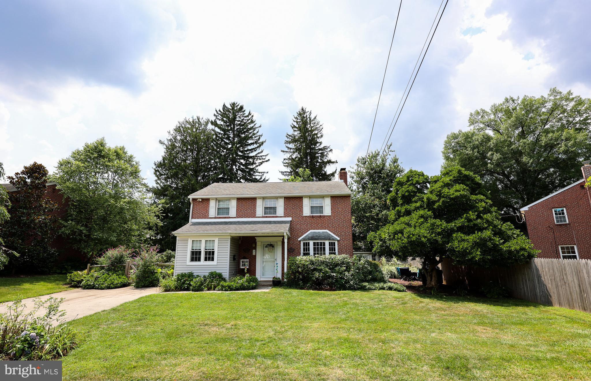 ***OPEN HOUSE- Fri, 7/31 - 5 pm - 6:30 pm***  Welcome to this classic Main Line traditional brick home, ideally situated on a quiet street in the highly sought after Radnor Township School District. Offering the coveted walk to Wayne lifestyle, you'll enjoy easy access to boutique shopping, acclaimed restaurants, parks, the Wayne Farmers Market, SEPTA’s Wayne train station, and everything that makes Wayne one of the Main Line's most desirable communities.A standout feature of this home is its exceptional first floor living. The spacious primary suite, added in 2020, was thoughtfully designed to be ADA compliant and features wide doorways, a level entry roll in shower, grab bars, and generous double closets with easy access. Whether you're seeking true one floor living, multigenerational lifestyle, or enhanced accessibility, this suite offers a rare combination of comfort, charm, and functionality. The main level also includes a second bedroom and a full bath, providing ideal accommodations for guests, family members, or a home office.The beautifully updated kitchen serves as the heart of the home with quartz countertops, an oversized island with seating, stainless steel appliances, a farmhouse sink, and a convenient coffee bar. The kitchen flows seamlessly into the spacious living room with a wood burning fireplace, creating an inviting space for everyday living and entertaining. The sitting room off of the kitchen overlooks the private backyard and opens to a paver patio, while a conveniently located first floor laundry area adds to the home's functional design.Upstairs, you'll find four additional bedrooms and a full bath, offering abundant space for family, guests, work from home needs, or hobbies.Outside, the fenced backyard provides a peaceful setting with room for gardening, entertaining, or simply relaxing. A paver patio and storage shed complete the outdoor space.With six bedrooms, three full bathrooms, an exceptional first floor layout offering an ADA compliant primary suite, a fully updated open concept kitchen, and an unbeatable walk to Wayne location, this home offers a rare opportunity to enjoy the very best of Main Line living.