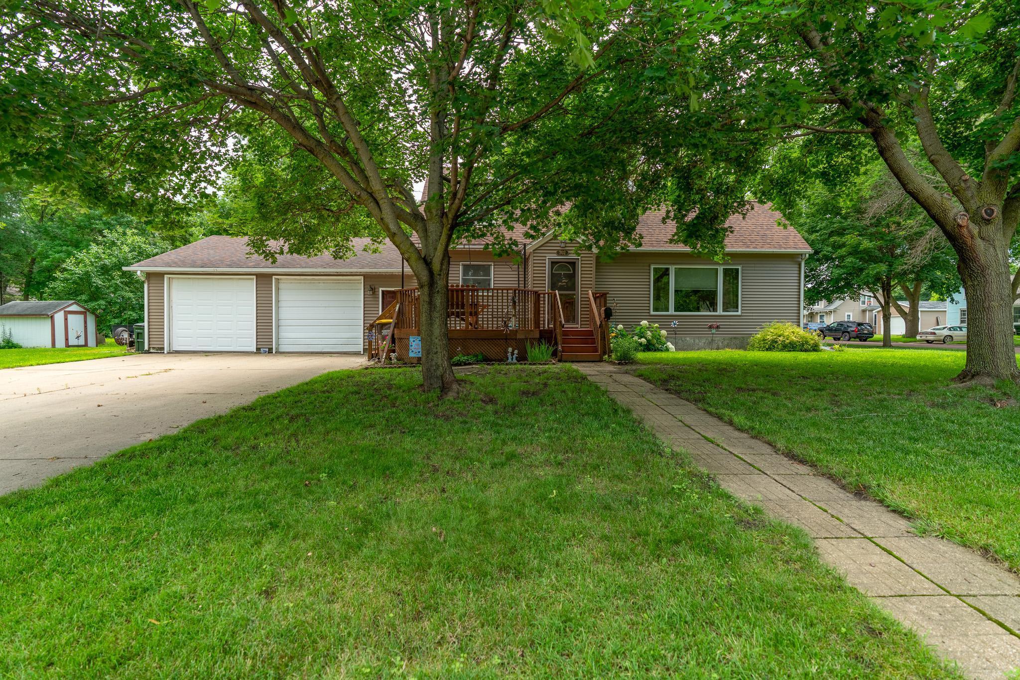 Spacious 5-bedroom, 2-bath home located on a corner lot in St. James. Originally moved to this location in the late 1990s, the home features a newer poured concrete basement with finished living space and egress windows for added flexibility. Main level includes a large living room, updated kitchen with two-tone cabinets and stainless steel appliances, full bathroom, and a bedroom. Upper level has two full-size bedrooms, a third flex room, and hall storage. Lower level offers a large recreation room, additional bedroom, full bathroom, laundry area, and separate storage space. Attached oversized 2-stall garage. The front yard features mature trees and a large deck perfect for outdoor seating. Shed included in backyard for extra storage. Recent updates and solid square footage make this a great option for anyone needing space.