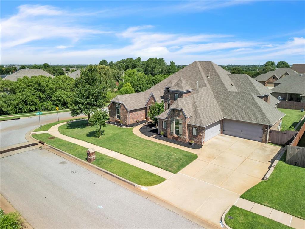 Rare Multi-Generational Living Opportunity With a 4 Car Garage – 3,717 Sq Ft of Comfort, Style & Space!

This beautifully designed corner lot residence is truly one of a kind—crafted to comfortably accommodate multi generations or a large family under one roof while offering exceptional style, function, and natural beauty throughout. 

The majestic entryway that opens into a bright and freshly painted expansive common area featuring 18-foot ceilings, natural stone accents, and extra-large windows that fill the home with warm, natural light. The open-concept layout flows seamlessly into multiple family and seating areas, offering flexibility for formal gatherings or casual connection. 

The kitchen is open with a breakfast bar, center island, dedicated coffee bar, separate cooktop area, and a walk-in pantry—perfect for preparing meals while staying connected to the heart of the home. Adjacent to the kitchen is a spacious dining area with views of the backyard.

With room to host large family gatherings or intimate evenings, this home offers a variety of flexible living spaces:
A media/theater room for movie nights or game days,
A formal dining or sitting room,
A dedicated office/library with custom built-ins,
A large flex room or playroom between two bedrooms with a private bath, and
A laundry and mudroom with abundant storage

Retreat to the luxurious primary suite, featuring a custom walk-in closet and spa-style private bath. A junior suite offers its own bathroom, walk-in closet, and even space for a sitting area—perfect for in-laws or guests.

Outside, enjoy your private oasis with a covered three-season porch and an extended patio w/ pergola. 

Features include a storm shelter, sprinkler system and access to a playground, nature preserve, and pond—offering tranquility and wildlife to view! 

This is a rare and thoughtful home, perfectly blending comfort, functionality, and elegance. Don’t miss your chance to own this one-of-a-kind property.
