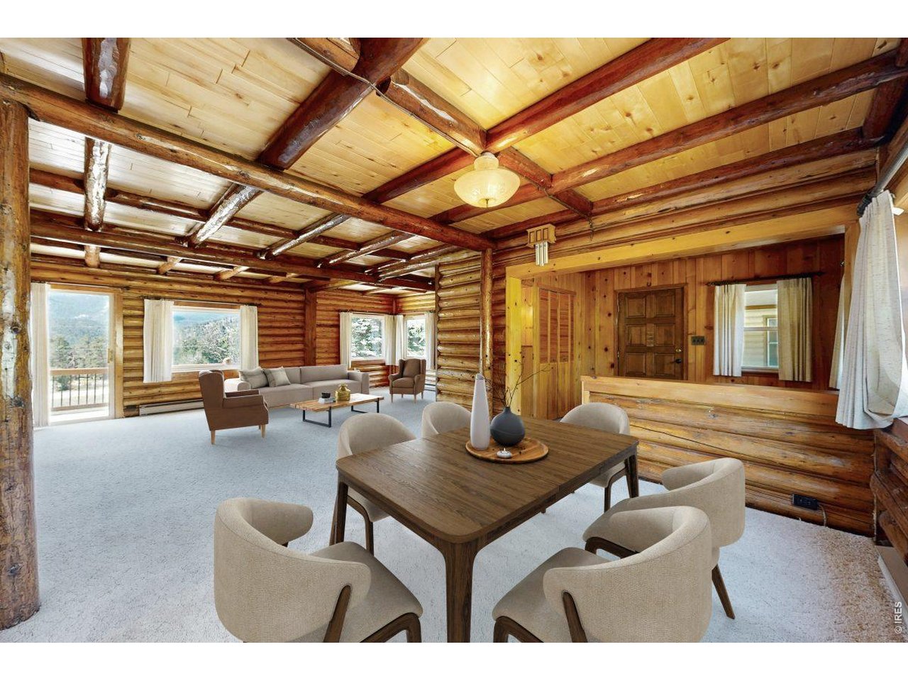 Discover the warmth and character of classic mountain living at 1991 High Drive in Estes Park, where sweeping views of the Continental Divide and the dramatic peaks of Rocky Mountain National Park create an unforgettable backdrop. From this setting, the mountains aren't just nearby. They're part of the view. Inside, rich wood finishes, log accents, exposed beams and a striking stone fireplace create a welcoming lodge-inspired living space. Large windows bring in natural light and views of the surrounding landscape, while the generous main living area provides plenty of room to gather, relax and enjoy evenings by the fire. The kitchen continues the home's mountain character with abundant wood cabinetry, updated flooring, ample counter space and a bright dining area surrounded by windows. Additional highlights include an updated vanity, in-home laundry and flexible spaces ready for a new owner's vision. Outside, the property offers room to breathe beneath the pines, along with a circular drive and substantial attached garage space for vehicles, mountain gear and all the toys that come with an Estes Park lifestyle. **A 30-amp RV hookup and sewer access add extra convenience for RV use.** And when you look beyond the property, the panoramic mountain scenery delivers exactly what people come to Estes Park hoping to find: big skies, forested ridgelines and iconic Rocky Mountain views. Full of personality and authentic Colorado cabin charm, 1991 High Drive offers the opportunity to embrace its vintage mountain style, make it your own and enjoy a setting that keeps the Rockies front and center.