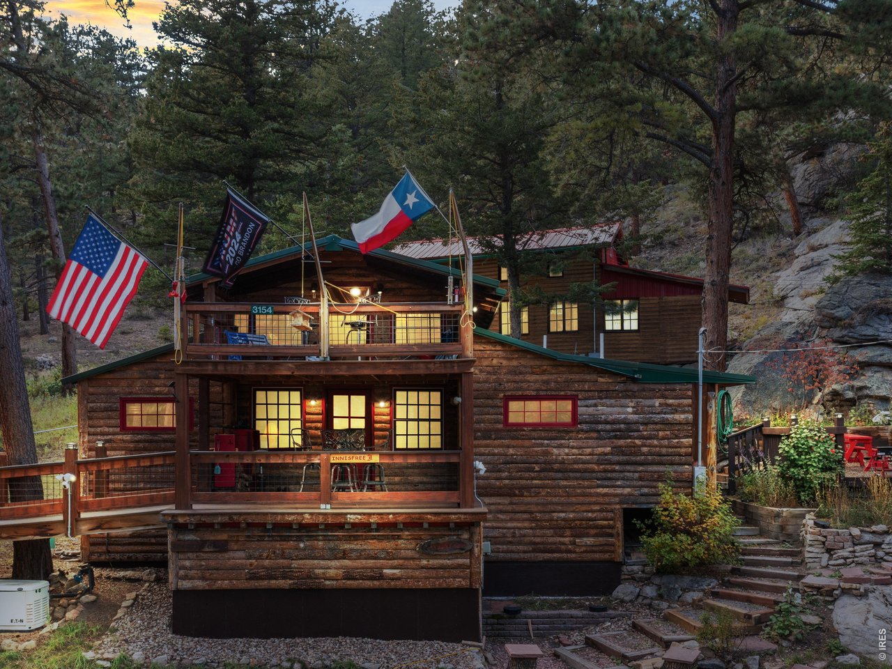 EFFECTIVE YEAR BUILT 2014 - Welcome to this beautifully renovated cabin located in the coveted Raymond - Riverside area. This extraordinary home offers the perfect blend of historic preservation and modern luxury, making it an ideal retreat for relaxation and adventure. Let the soothing sound of the river rejuvenate you as you unwind on the deck or private balcony. As you step inside you'll immediately notice the quality craftsmanship and upscale renovation throughout. The entire cabin has been meticulously restored, with walls rebuilt from the studs up and finished in knotty pine tongue and groove. All windows and doors have been replaced to ensure comfort and style. A spiral staircase leads to the second story, where the primary bedroom features vaulted ceilings and opens to a private balcony. From here, you can enjoy the sights and sounds of the river, observe acrobatic hummingbirds, and gaze at the star-filled dark night sky. Custom lighting enhances the ambiance throughout the cabin, including the updated kitchen, which boasts new appliances and cupboards. The bathroom is thoughtfully designed, featuring repurposed divided light windows as linen cabinet doors, a lion's claw tub, and a stand-alone shower. The property sets back off of Riverside Drive, providing a tranquil setting, Additional amenities include a workshop and a utility closet accessible by an exterior door on the kitchen level as well as a generous utility room with storage accessed by an exterior door from the lower level. The landscaped yard features rock walls and stairs leading to a patio, just steps from the kitchen. Enjoy year-round outdoor activities in the nearby Indian Peaks Wilderness and Rocky Mountain National Park. The cabin is also a short drive from the vibrant mountain towns of Lyons, Allenspark, Jamestown, and Estes Park, where you'll find excellent restaurants, shopping, and festivals.