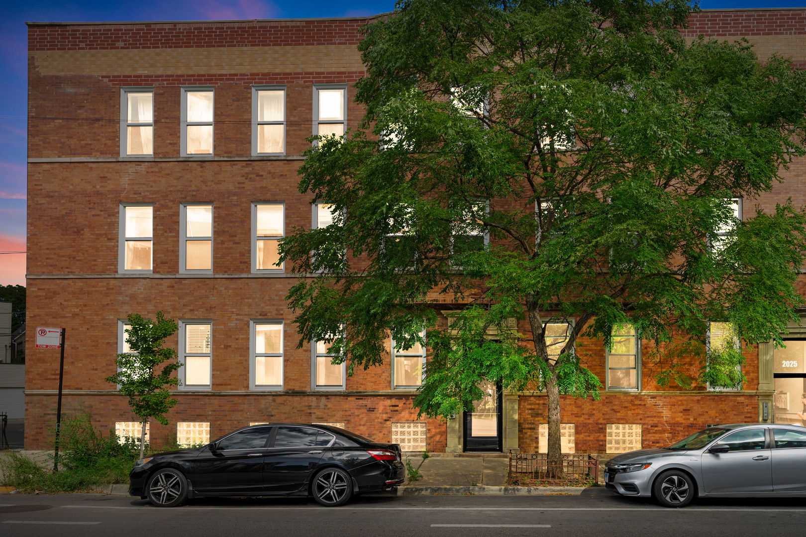 Seller with a vibe seeks buyer with a dream. Armitage corridor brings life to the Logan Square neighborhood. Wide boulevards, sprawling park space, & a booming restaurant scene draw friends to you. 1st floor walk-up leads to a 1 bed 1 bath home. Inside this previous factory space, the ceilings soar while brick walls both warm & welcome with old world charm. Oversized windows allow sunsets & west views of a 1900's historic church. Hardwood floors gleam throughout the living, dining, & kitchen. Fireplace, with custom surround & mantle, has been thoughtfully added along with fresh lighting with dimmers for ambiance. Kitchen welcomes home chefs with new appliances including 5-burner gas stove, venting microwave, French door fridge with ice, & dishwasher. East light with an outdoor view from the kitchen should be on a must-have list. Solid stone & butcher block counters with breakfast bar give the space to prep & entertain. Past the in-unit laundry, bedroom provides 2 closets for wardrobe & vanity. Bathroom has tile to the ceiling in shower/tub combo with window. Updated faucets & fixtures feel fresh, next to linen closet for storage. Back patio is private off kitchen with room for grill storage & furniture. Basement storage is massive with both a window & electric; an artists studio space for the creative type. Back yard has green grass, fire pit, & trees for shade; dog owners rejoice. Church rents parking for $65/month per car with access from back door. Located only 2 blocks from California Blue line train, downtown or O'Hare are only a turnstile away. Proximity to farmers market, Milwaukee Ave, & Palmer Square are so close it should become your new weekly ritual. Everything you need is just outside your door. Explore local gems like Small Cheval, Gretel, Parson's, Lonesome Rose, & Bang Bang pie. Curate the good life. Reach out to see your new space in person. Welcome home!