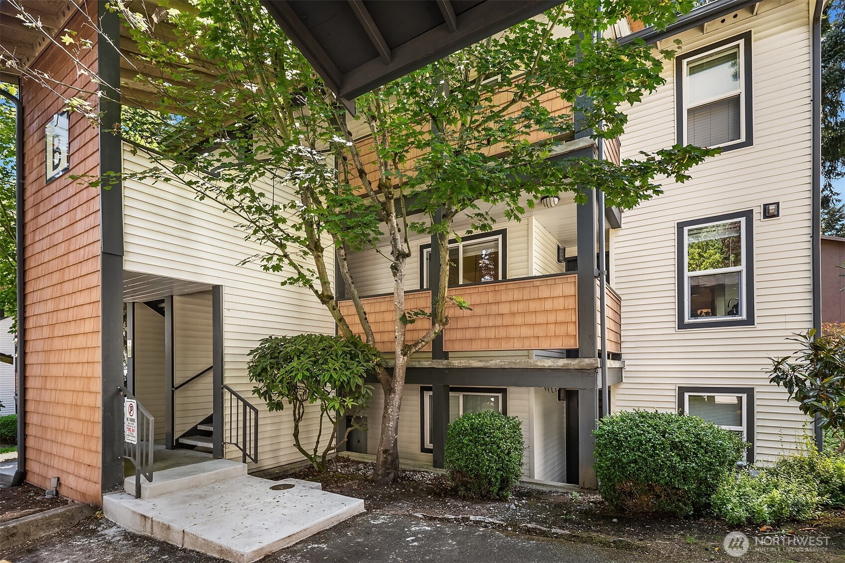 Bright and private end unit with peaceful tree-lined views! Freshly painted throughout—including doors and trim—this move-in ready Edmonds condo offers an open floor plan perfect for everyday living and entertaining. The kitchen features granite counters, stainless steel appliances, a new fridge, and newer dishwasher. Spacious living room with cozy wood-burning fireplace opens to a private deck with storage. The primary bedroom includes a large closet and ensuite ¾ bath. Second bedroom is generously sized and doesn’t share a wall with the primary! Updated full bath, in-unit washer/dryer, covered parking. Pet-friendly, no rental cap, no special assessments. Close to transit, freeways, Costco & more!