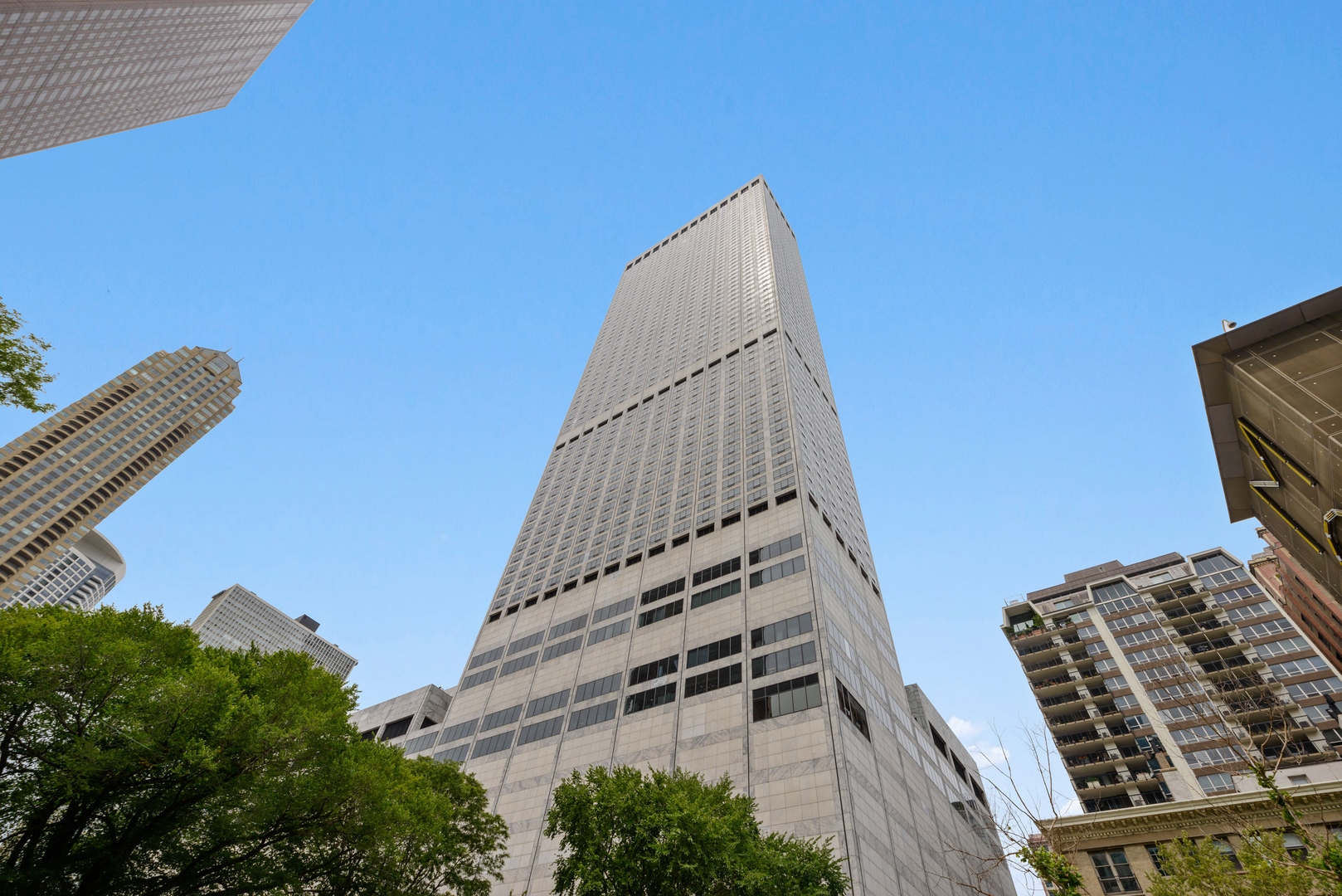 Formerly the home of Oprah Winfrey, a one-of -a-kind, 3655 square foot, northeast corner, floor plan at the luxurious Water Tower Residences. 56th floor home features impressive, sweeping lake and city views framing Navy Pier to the East exposure and up to Evanston along the shoreline of Lake Shore Drive to the North exposure. The lake seems more like an Ocean through the 25 oversized windows with motorized shades. Your gut to concrete rebuilt renovation was completed in December 2016 by Centaur Interiors incorporating their hallmark traits which utilize the finest materials and fixtures, state-of-the-art technology and exceptional attention to detail. Your mint and turn key condition residence offers a spacious 3 bedroom layout that could easily be 4 bedroom, if desired, by  simply closing the pocket doors between the living room and library. This exceptional lay out with unforgettable views from EVERY ROOM in the home features exquisite hardwood floors, Smart House with the Elan system that controls the lighting, shades, music, TVs and the climate,   within enormous room sizes for your lifestyle of easy living and gracious entertaining. Enjoy your large foyer, oversized custom designed eat-in kitchen with all the bells and whistles such as Wolf steam and convection ovens, a Wolf microwave and an electric induction cooktop. It also has a Subzero refrigerator, freezer and two 40-bottle Subzero wine coolers. Your will love the primary suite with oversized luxurious bath and two large walk in closets, a large laundry room with side by side washer/dryer, a fitness room and so much more that you must come to see in person.  This treasured home is perfectly located above the exclusive and newly renovated Ritz Carlton Hotel offering you all the coveted amenities- concierge, room service, spa, fitness, indoor pool- that make you feel like you're living in a resort every day. On site valet or self- parking options available to residents and their guests. Dogs welcome too!