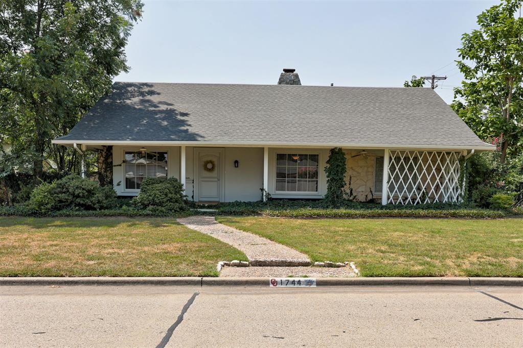 Welcome to this charming cottage-inspired retreat, where timeless character meets everyday comfort in one of Norman's most desirable locations—just minutes from the University of Oklahoma. From its inviting curb appeal and welcoming front porch to its beautifully landscaped grounds, this home offers warmth and personality at every turn.Inside, you'll find spacious living designed for both relaxing and entertaining. The expansive living and dining area is anchored by a beautiful gas-log stone fireplace, while a second wood-burning stone fireplace creates a cozy and unexpected focal point in one of the generously sized bedrooms. Thoughtful built-ins and abundant storage throughout the home provide both charm and functionality.The kitchen is full of character, with an impressive stone hearth surrounding the cooktop, double ovens, and plenty of space for meal preparation and for gathering with family and friends. Just beyond the main living area, the screened-in patio offers the perfect place to enjoy your morning coffee or unwind in the evenings, seamlessly extending your indoor living space outdoors.The spacious primary suite features a beautifully updated ensuite bath complete with dual vanities, a relaxing garden tub, and a separate walk-in shower. Two additional bedrooms and three full bathrooms provide flexibility for family, guests, or a home office.Step outside to your own private backyard oasis. Surrounded by mature trees and lush landscaping, the sparkling pool—with a newer liner installed just three years ago—creates the perfect setting for enjoying Oklahoma summers. A fenced side yard, covered entry from the garage, and peaceful outdoor spaces complete this truly special property.If you've been searching for a home with distinctive character, generous living spaces, and an unbeatable location near OU, this one is ready to welcome you home. Call today for your personal tour!