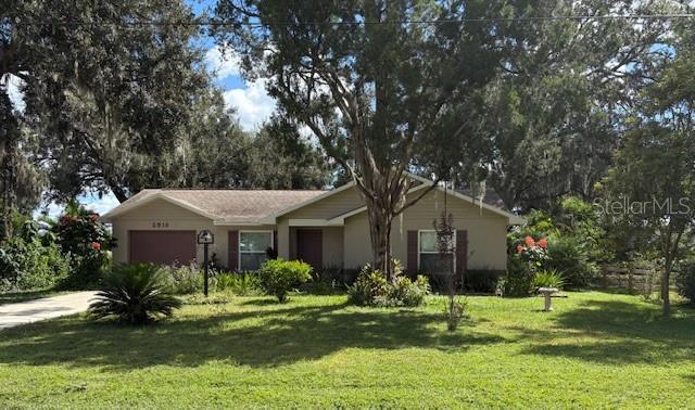 Absolutely Adorable Cottage — No HOA, No CDD, No Fees!
WOW — so, so CUTE! This cozy cottage with an attached garage sits on nearly ¼ acre of beautifully manicured, fully fenced property filled with colorful, blooming plants and mature trees.
The front living room opens to the kitchen and dining area, creating an inviting flow for daily living or entertaining. The kitchen features a convenient pass-through counter/bar, perfect for hosting friends and family.
The primary bedroom includes an en-suite bath with a walk-in shower (with dual seats) and a spacious walk-in closet. The hall bath features a tub—perfect for a relaxing bubble bath.
Major updates were completed in approximately 2018, including a NEW roof, NEW HVAC, and complete re-plumbing. You’ll also find upgraded engineered wood-laminate flooring in the front room and both bedrooms. All windows and French doors have been replaced with double-pane storm-rated glass for efficiency and peace of mind.
The extended lanai overlooks a lush backyard oasis with a privacy fence and a wide variety of tropical plants: Pomelo (grapefruit-like), Pomegranate, Plumeria, Moringa, and Pineapples—just to name a few! Sit under the canopy-covered patio or enjoy the classic 50-year-old metal swing while hummingbirds and butterflies flutter by.
This home truly has it all — character, comfort, and charm. Don’t wait — call today to schedule your personal tour!