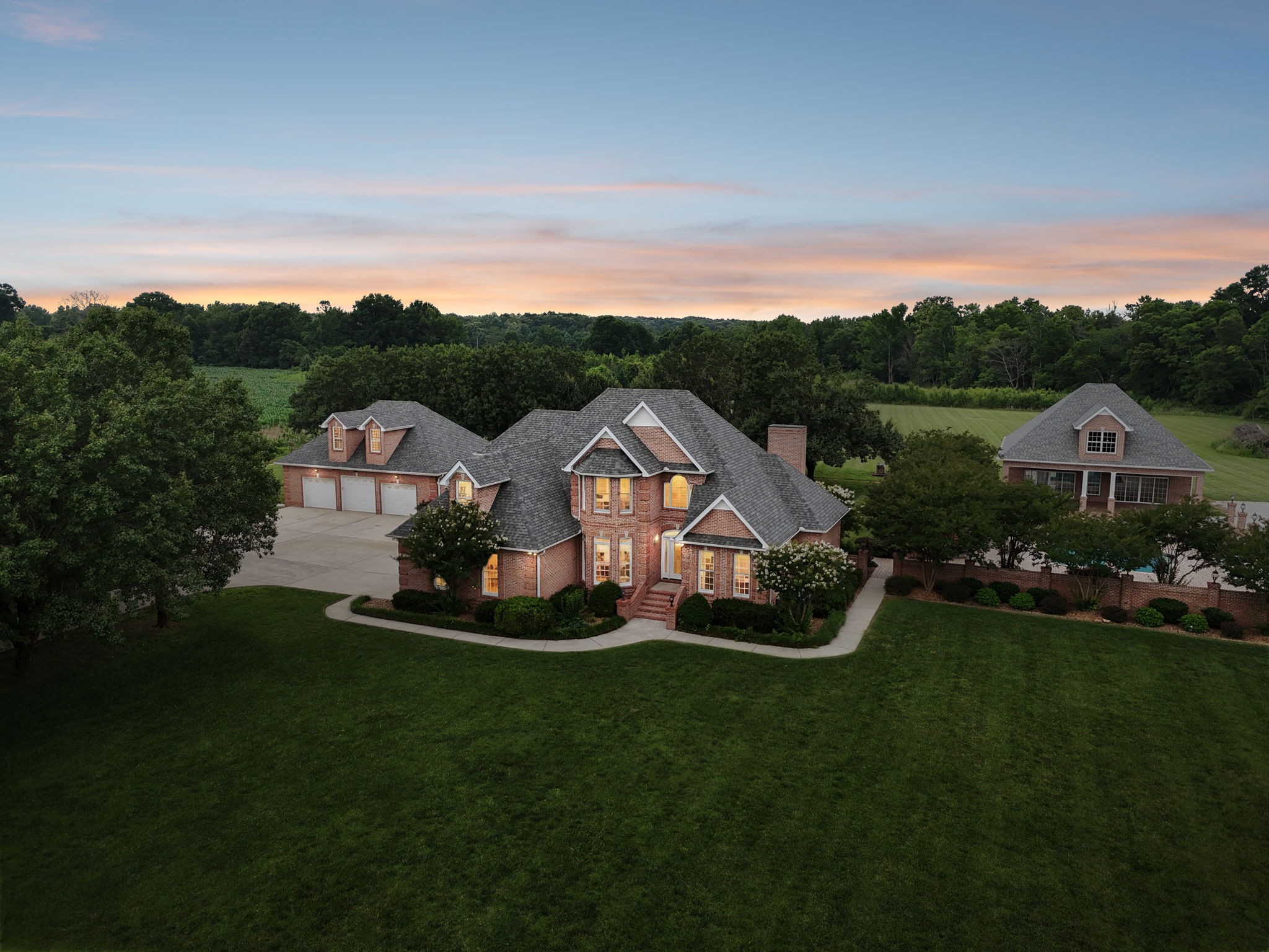 Exceptional property on 10.5 sprawling acres offering the perfect blend of space, comfort, and resort style outdoor living. The main residence features 3,617 sq. ft. with 6 bed, 3.5 baths, providing ample room for family, guests, and entertaining. The well appointed kitchen showcases beautiful hickory cabinetry, black stainless steel appliances, quartz countertops, abundant storage and generous workspace. The home also as an Electrolux vacuum system built into it.  A standout feature of this property is the impressive 2,840 sq. ft. Pool House, thoughtfully designed with stunning tongue and groove ceilings, real hardwood floors, and a full kitchen equipped with stainless steel appliances and granite countertops. Whether used for entertaining, extended family accommodations, a game room, or private retreat, this building offers endless possibilities. Step outside to your own private oasis centered around a spectacular 24x40 custom in-ground pool featuring 2 swim-outs. The expansive outdoor setting creates the ideal environment for relaxing, hosting gatherings, and enjoying year round recreation. With over 6,400 square feet of combined living space between the main home and pool house, premium finishes throughout, and exceptional indoor-outdoor amenities, this one-of-a-kind property presents a rare opportunity to own a true entertainers dream.