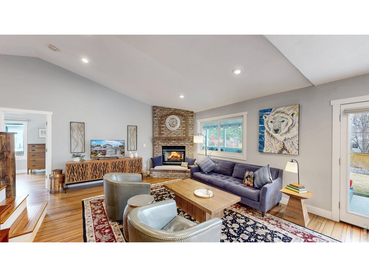 Exceptional home in Huntington Hills filled with style, character, and thoughtful updates. From the moment you step inside, you'll notice the difference-stunning wood paneling and exposed beams along the staircase create a striking architectural centerpiece. Bamboo flooring flows throughout the main level, adding warmth and sophistication. The beautifully updated kitchen is both stylish and functional, featuring a large island, abundant roll-outs, and soft-close doors and drawers-perfect for everyday living and entertaining. The spacious main-floor primary suite offers two separate closets and a beautifully remodeled 5-piece ensuite bath complete with a luxurious soaking tub. Large windows throughout the home fill the generous bedrooms and living spaces with natural light, creating an open, airy feel. The basement includes a fifth bedroom and is already roughed-in for a future fourth bathroom. Step outside to a truly magical backyard designed for year-round enjoyment. Carefully selected plantings bloom throughout the seasons, providing vibrant color and privacy. The enormous covered deck is ideal for relaxing or hosting gatherings. In the front yard, the spectacular Hot Wings Maple steals the show with brilliant color in summer and fall.Major updates include a Lennox furnace and A/C (2020) and Andersen windows installed in some rooms in 2020, along with newer dishwasher, microwave, and oven. The Huntington Hills HOA offers fantastic amenities including a pool, tennis/pickleball courts, playground, basketball and clubhouse. The location is unbeatable-just one house from the pool, one block from Prairie Dog Meadow Natural Area, and close to Fossil Creek Park. Zoned for Werner Elementary School, Preston Middle School, and Fossil Ridge High School. A rare combination of character, location, and thoughtful upgrades-this is a home you won't want to miss.