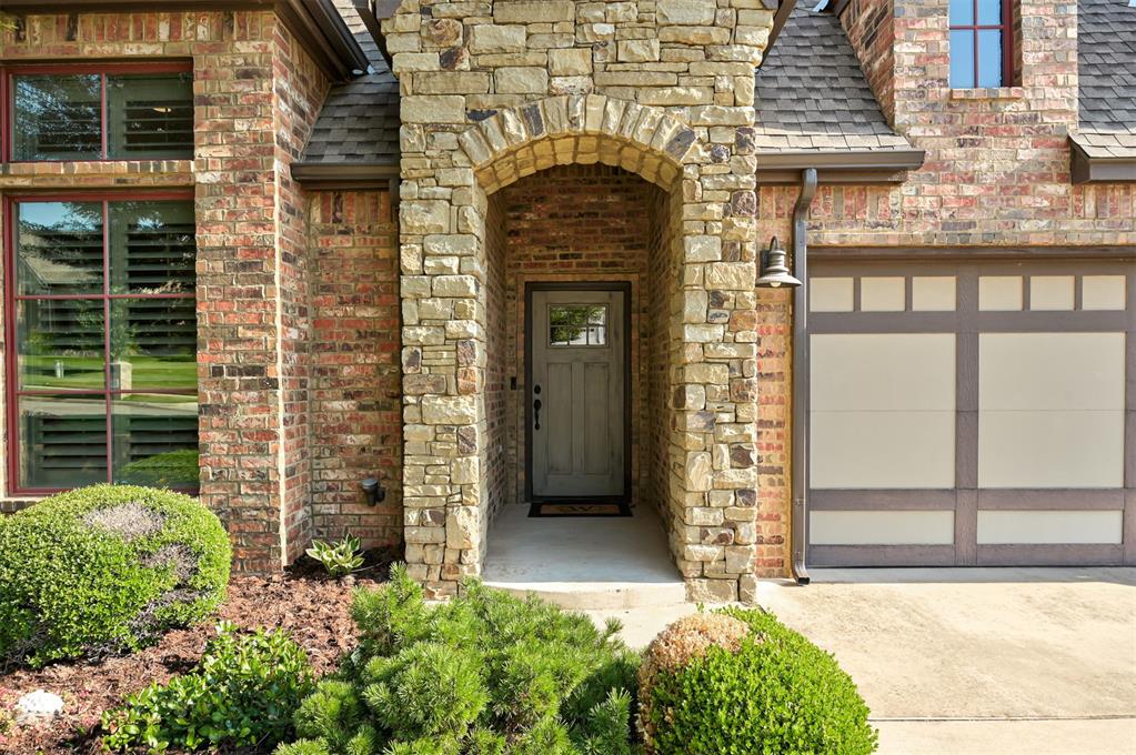 Custom-built beauty with soaring vaulted ceilings, wood floors, chef’s kitchen, & two fireplaces! Stunning covered patio with cathedral ceiling & masonry fireplace — move-in ready perfection in Birnam Woods!  Prepare to be wowed by this exceptional custom-built 3 bed 2 bath home, where luxury and craftsmanship meet flawless design. Stunning hardwood floors flow seamlessly through the spacious entry, gourmet kitchen, inviting living room, and elegant study featuring soaring vaulted ceilings, built-in shelving, and a trendy sliding barn door. The chef’s kitchen has premium granite countertops, high-end appliances, a built-in buffet, an expansive island with breakfast bar, and a massive walk-in pantry that will delight any culinary enthusiast. The grand living area boasts soaring vaulted and beamed ceilings, a cozy Cosmo 42" gas fireplace, and expansive windows that open to a breathtaking covered patio with its own vaulted ceiling and a gorgeous stacked stone fireplace—perfect for unforgettable gatherings year-round. The luxurious master suite is a true retreat, showcasing a dramatic wood plank accent wall, frameless glass shower, dual vanities, and a custom walk-in closet built for organization and style. Additional upscale touches include a sprinkler system, solar roof decking, elegant redwood windows at the front, plantation shutters, designer lighting, a fenced yard, and professionally landscaped grounds.