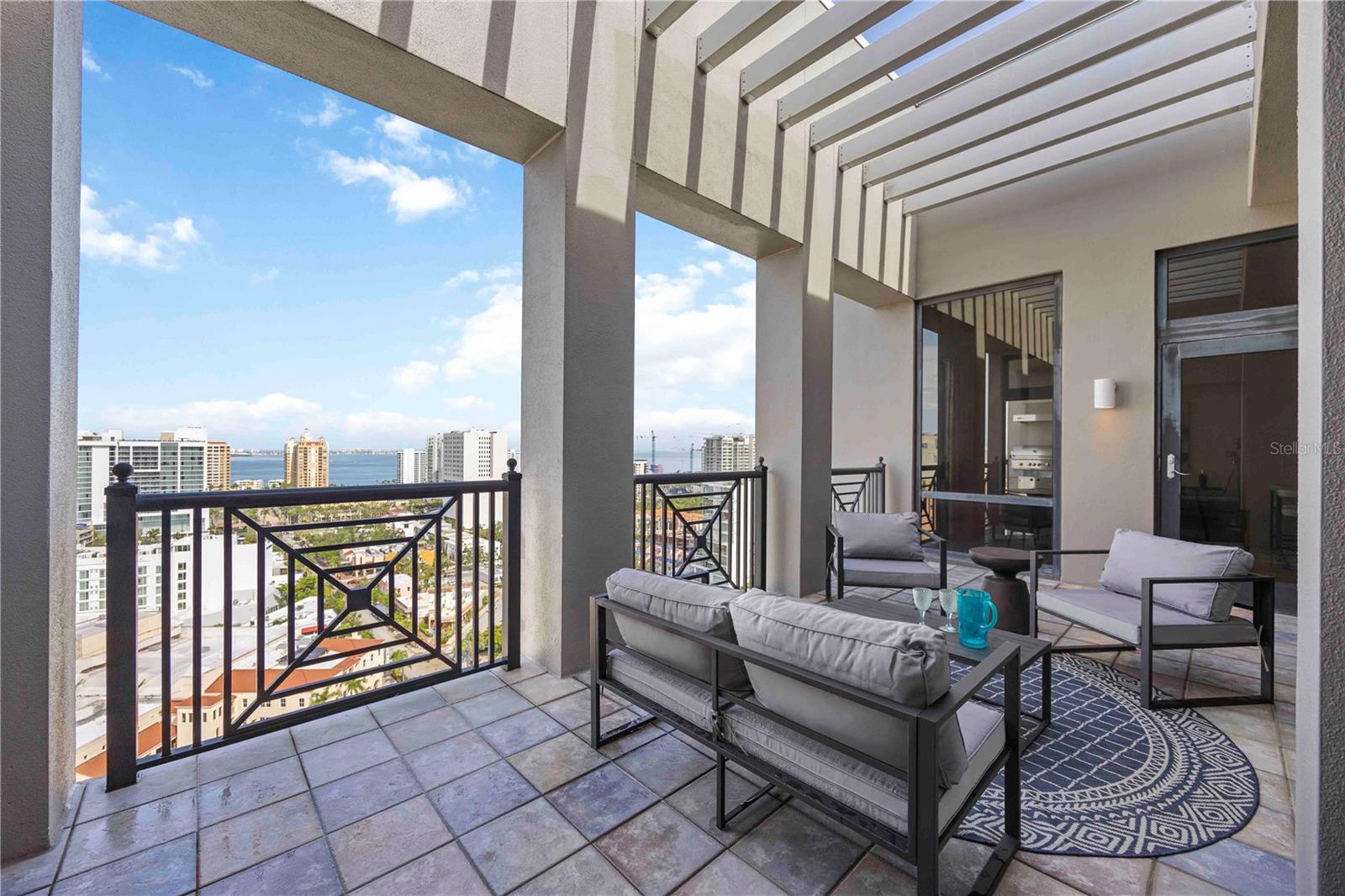 This penthouse is the definition of LUXURY living in downtown Sarasota! Exquisite city views from every angle. Stunning views of Sarasota Bay and the Ringling Bridge will leave you speechless. The warm feeling of home with all of the amenities of a luxury condo to satisfy the most discerning buyer. The foyer welcomes you with gorgeous marble flooring leading into your formal dining room and living space. A picturesque kitchen well equipped with stainless steel high end appliances, an over sized island, & solid wood custom cabinetry. Elegant custom lighting throughout creates the ambiance you deserve. This condo is perfect for entertaining your guests with 3 terraces, a double sided fireplace, and an outdoor kitchen. The master suite offers a complete sanctuary to escape with serene views of the vast waterways. The owner's suite bathroom has everything you desire with a massage spa tub, walk-in shower, separate vanities with dual sinks, and a bidet. The split plan offers complete privacy for your guests and the same fabulous views. The office is perfectly situated with western city and water views. This condo is unique with 3 storage units. Plaza at Five Points amenities include: concierge services, a private lobby, valet parking, well-equipped fitness room library, meeting room, a guest suite, and clubhouse with a fireplace & full kitchen. The 10th floor garden terrace with a heated pool, spa, a screened gazebo, and a sun deck, perfect for enjoying the sun. The 10th floor terrace has breathtaking views for your guests to enjoy as well. Building stewards are on call from 7:00 a.m. to 11:00 p.m. The building has secured entry at all doors and elevators. The garage is gated for owners-only access to two deeded parking spaces. This is everything you have been looking for! PRICED WELL BELOW APPRAISED VALUE!