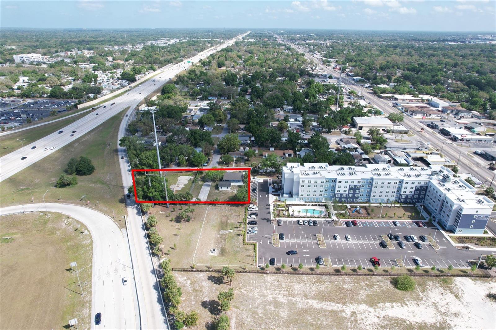 Prime Development Opportunity in Tampa’s Growing Corridor. OWNERS ARE MOTIVATED!Now available: nearly one acre of strategically positioned commercial property at 705 E. Wilma Street, just off Busch Blvd and Nebraska Ave, and directly fronting the high-traffic I-275 entrance/exit ramp. This exceptional site sits next to a brand-new large-scale multi-family development, amplifying both visibility and future demand.The property consists of three parcels (formerly 701, 705, and 801 E. Wilma Street) and already carries the highly sought-after RM-20 zoning, saving you valuable time in the development process. Current income is in place through an existing single-family home and detached two-car garage. The tower on the property is in the process of being decommissioned—clearing the way for redevelopment.With unmatched exposure to millions of vehicles each month, this site is a rare opportunity for developers seeking high visibility, convenient Interstate access, and the chance to create a signature project in one of Tampa’s fastest-evolving corridors.Don’t miss the chance to secure this property and bring your vision to life.