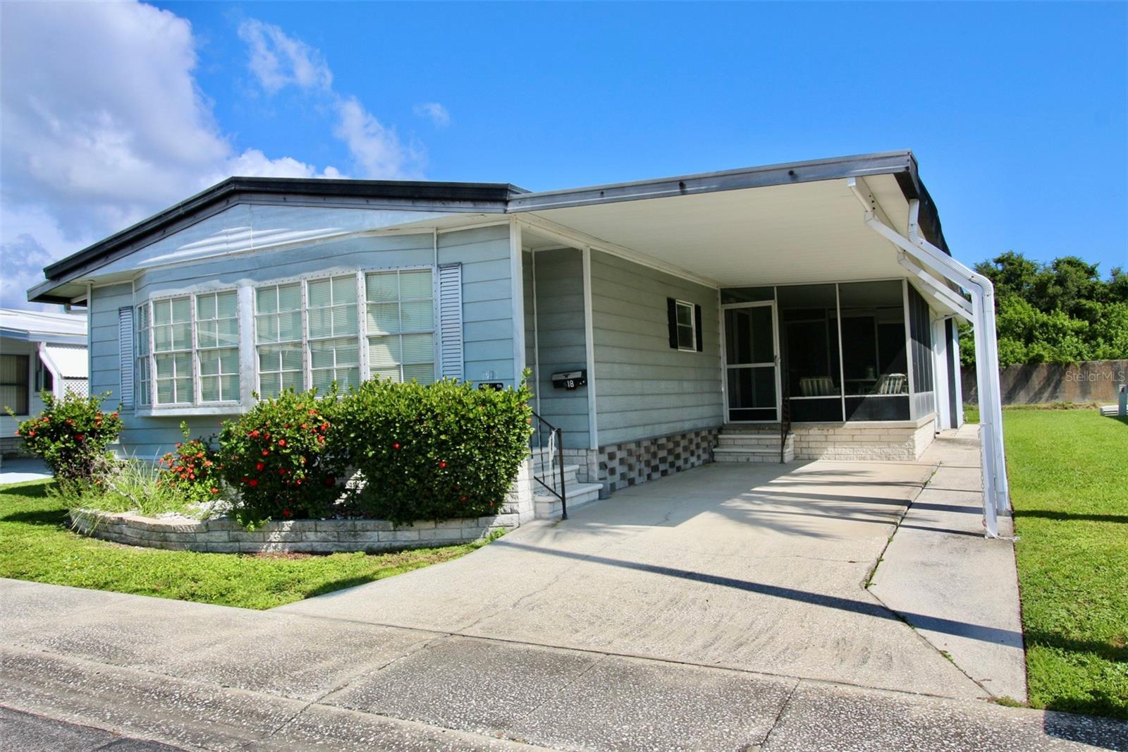 **GOLDEN GATE SPECIAL! RESIDENT OWNED COMMUNITY** BRAND NEW COMFORTMAKER AC SYSTEM (2025) Spacious fully furnished 2-bedroom, 2 full baths with over 1300 heated square feet of living area. Open floorplan, large enough to entertain all of your family and friends. Enormous primary bedroom with ensuite private bath, low step in shower with two seats and grab bars. Gigantic walk-in closet and ceiling fan. Second bedroom has a full-size closet and private access to guest bathroom. Guest bath has a tub/shower combo and grab bars. Awesome family room with a wet bar and soaring cathedral ceiling. Dining room has a beautiful built-in China cabinet with glass display. Decorative archways and ceiling fans throughout. Home offers a separate room with endless possibilities. Owner currently uses the room for an office; buyer could convert back to a huge interior laundry room. Nice screened outdoor living area. Owner added concrete strip along carport for his scooter and also has a covered scooter garage that could be converted for future golf cart. Large outside laundry/workshop room with lots of storage and shelf space. Metal outside exterior and roof over. High and dry flood zone X, home had no damage from last year hurricanes. Backyard is surrounded with natural privacy overlooking tranquil freshwater canal revealing Florida's majestic birds and wildlife. Wonderful opportunity to be the new owner in one of Pinellas Counties Elite 55+ active resident owned communities with a low monthly fee of only $210.00! Tropical Florida Lifestyle Living offering a sparkling heated in ground pool, heated spa, shuffleboard courts, horseshoe pits, bocce ball court, clubhouse, billiard room and endless scheduled activities. Easy access to Tampa, St. Petersburg, all major highways, interstates and Our World-Famous Sugar Sand Beaches! This is a cash only community. Call and schedule your private showing and make this your Florida home today!
