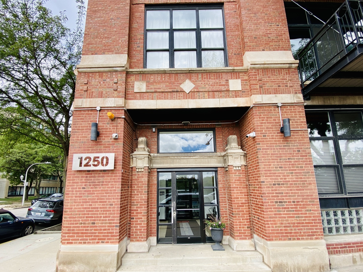 Amazing opportunity in West Loop, DEEDED PARKING INCLUDED! Step into this classic timber loft with approximately 800 sq. ft. one bedroom condo located in a converted warehouse building with exposed brick and heavy timber details. The soaring 14 ft ceilings create a sense of spaciousness, while the private balcony offers quiet, expansive northern exposure views of the city. Cozy up beside the gas fireplace, and entertain effortlessly in the OPEN CONCEPT kitchen and living space with granite countertops, a spacious island.  This inviting loft also features convenient IN-UNIT LAUNDRY, abundant closets plus additional storage cage. The living space boasts gorgeous hardwood floors, while the bedroom offers carpet for added comfort. Stay comfortable year-round with central heat and air conditioning. Investor-friendly, with LOW HOA, a 6-month minimum lease term and no rental cap, this professionally managed building offers bike storage and on-site gated exterior parking. Located in the vibrant West Loop, this home is close to public transportation, highways I-290 and I-90/94, Skinner Park, Whole Foods, Target, Rush Hospital, Mariano's, Greek Town, Restaurant Row on Randolph Street, Fulton Market, dining, shopping, nightlife, UIC, Medical District. Don't miss out on this incredible opportunity to experience the best of city living with investment upside potential with United Center Redevelopment 7 Billion investment 1901 Project!