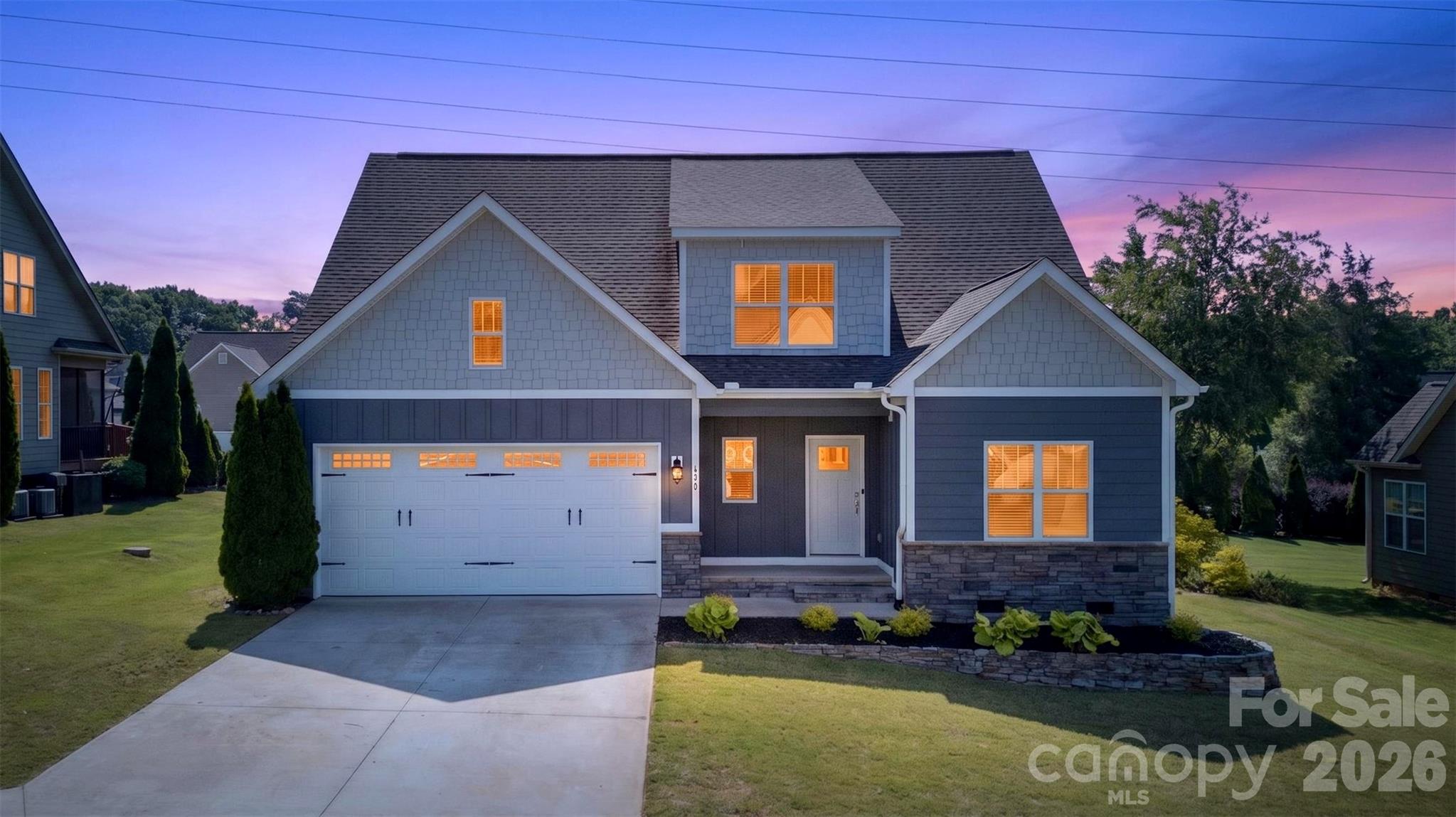 Some homes simply give you a place to live. Others give you a place where life can truly unfold—Saturday morning breakfasts, homework and conversations around the kitchen island, holiday dinners, birthday celebrations, and quiet evenings together by the fire. At 415 S Pendernale Drive, there is room for all of it.Built in 2019 by Sill Homes, this warm and welcoming Mill Brook home offers the quality, comfort, and modern construction today’s buyers want. The attractive Hardie Board exterior and polished curb appeal make a wonderful first impression, while beautiful hardwood floors create a warm flow throughout the main living areas.At the heart of the home is one of the largest kitchens in the neighborhood, opening seamlessly into a spacious great room with soaring vaulted ceilings and a cozy gas fireplace. It is one open, inviting space designed for everyday moments and special occasions alike.Because life rarely stays the same, this home is ready to grow and change with you. Five bedrooms, three full bathrooms, and an additional flex room provide space to come together—and room for everyone to recharge. The flex room can easily become a nursery, guest room, second office, or creative retreat.The main-level owner’s suite offers a peaceful place to unwind with a tray ceiling, garden tub, separate shower, double vanity, and walk-in closet. A second bedroom and dedicated office downstairs provide added flexibility for guests, working from home, or multigenerational living. Upstairs, three more bedrooms—each with its own walk-in closet—share a conveniently located full bathroom.The screened porch invites slow mornings with coffee and quiet evenings at the end of the day. An adjoining deck overlooks the smooth, level backyard, offering approximately one-quarter acre for cookouts, outdoor games, gardening, or gathering around a fire pit.Thoughtful conveniences include a main-floor laundry room with an upgraded utility sink and walk-in storage, tankless gas water heater, two-car attached garage, public water and sewer, and an HOA of only $160 per year.Located in the Dorman High School District, approximately 0.4 miles from Anderson Mill Elementary, this 2,565-square-foot home offers more than space—it offers a setting for everyday routines, meaningful milestones, and memories still waiting to be made. Come experience 415 S Pendernale Drive and imagine your story here.