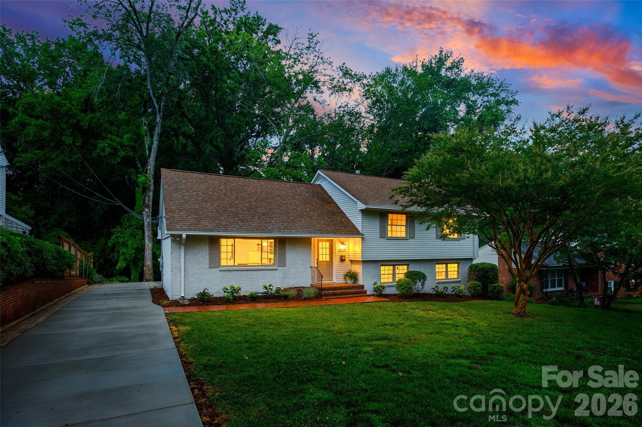 Beautifully renovated and thoughtfully reimagined, this stunning home at 3130 Spring Valley Road offers modern design and quality craftsmanship. Excellent floorplan and open-concept living on the main level, great natural light, refinished hardwood floors on the main and second level, fresh paint, new trim, doors and hardware. Kitchen features all-new cabinetry, a large island, quartz countertops, stainless steel appliances, undermount sink, updated faucet, garbage disposal and stylish pendant lighting along with spacious pantry with custom shelving -- open to living room and dining room with door to rear yard. Primary suite on the upper level with two secondary bedrooms. Fourth bedroom privately located on lower level. All three full bathrooms have been fully renovated with designer tile showers, updated flooring, new vanities, toilets, fixtures, mirrors and lighting! Wonderful bonus room on the third level with amazing storage, walk-in closets (optional 5th bedroom), charming built-in drawers and new carpet. Luxury vinyl plank flooring in the lower level with large family room with brick fireplace, storage closet and door to rear patio. Functional laundry room with counter space and utility room. Mechanical upgrades include a new HVAC condensing unit, evaporator coil, ductless mini-split system in the attic, new water heater and laundry pump. The exterior has been refreshed with new paint,  new concrete driveway and back patio and updated brick patio surround, enhancing both curb appeal and outdoor living. Excellent location minutes from Southpark, Greenway access and convenient to Uptown. This home is move in ready and a must see!