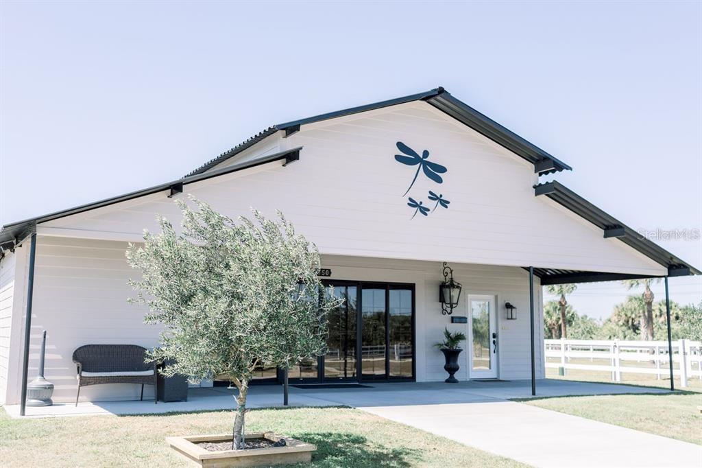 Operating event venue with brand recognition and confirmed bookings into 2027. The centerpiece is a 5,000+ SF barn converted from an 11-stall stable into an elegant event facility featuring Bride & Groom suites, office, pavilion, terrace, catering/staging areas, restrooms, and storage. Sale includes all inventory including the champagne truck! Approx. 4± acres are improved with an additional 4.5± cleared acres ready for expansion - consider weekday events, community programming, vendor packages, or on-site lodging- the possibilities are truly endless!

Additional parcel available and ideally combined sale with adjacent 704 Osmosis (4BR/3BA, 2,793 SF pool home on 2.67± acres) for a total 11± acres. Great area for Airbnb income. Financials and booking summaries available with NDA.