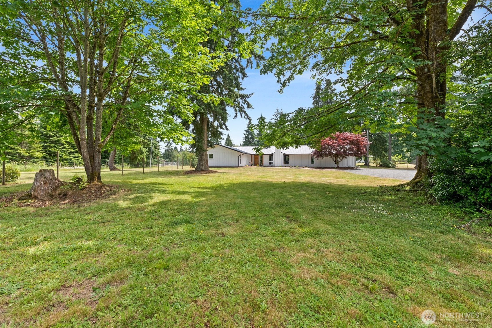 Do you want an AMAZING 2,868 sq ft shop with 4 bays, RV hookups, additional covered RV parking, and office space is perfect for car enthusiasts, hobbyists, or anyone needing space for all their toys! Remodeled with style and class, this expansive 3,200+ sq ft home is filled with natural light. Fresh interior and exterior paint, new flooring, a bright updated kitchen, and gorgeous bathrooms add charm. Enjoy two spacious living rooms, an office/den, and large bedrooms, including a luxurious primary suite with covered patio access. A separate living area with its own kitchen and entrance is ideal for guests, rental income, or multigenerational living.