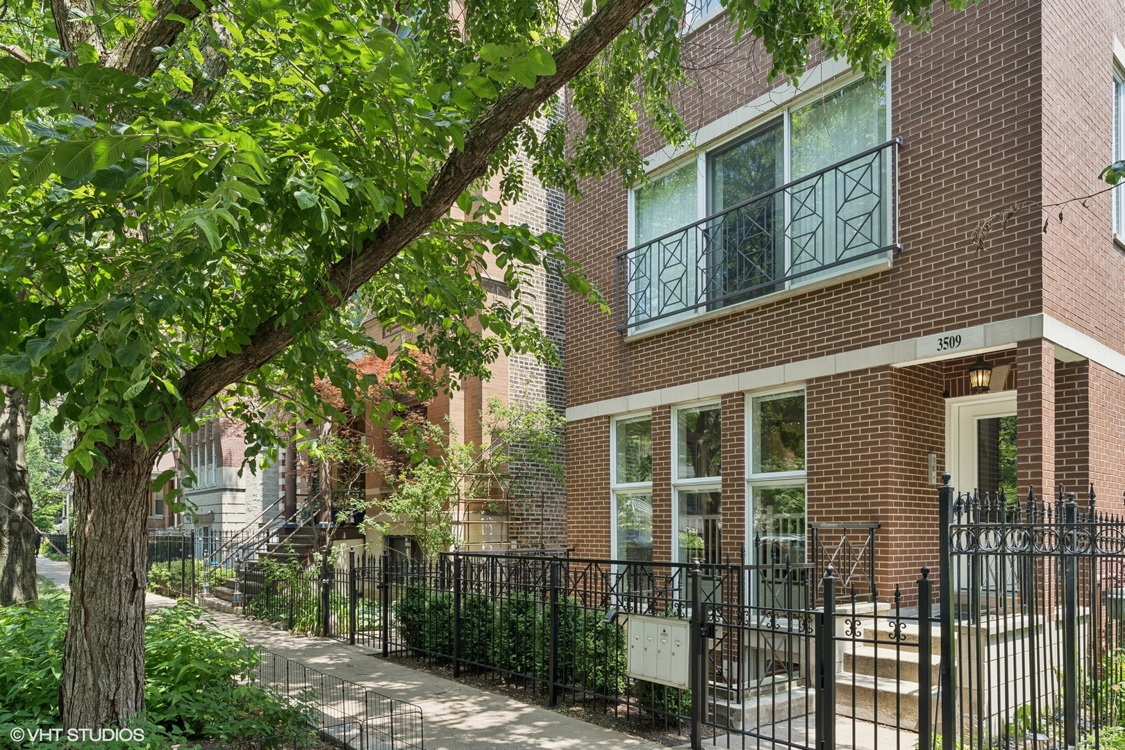 Welcome to your sophisticated sanctuary at 3509 North Fremont Street, Unit 3F in Lake View! This top-floor penthouse duplex-up delights with its spacious design, reminiscent of a single-family home. Nestled on a peaceful, tree-lined, one way street, the unit features an open floor plan drenched in natural light from oversized windows. Enjoy the luxury of a private deck situated amongst the tree-tops, accessible from the living room, perfect for entertaining. The modern kitchen is outfitted with stainless steel appliances and white cabinetry, while a convenient half bath serves the main floor. Retreat upstairs to the sublime primary suite complete with a walk-in closet and en-suite bath with double sinks. With in-unit laundry, central AC, and parking, this home offers ultimate comfort. Nearby Wrigley Field games & concerts, Gallagher Way, Southport Corridor dining hotspots, parks, and the Addison EL train keep city life at your doorstep.