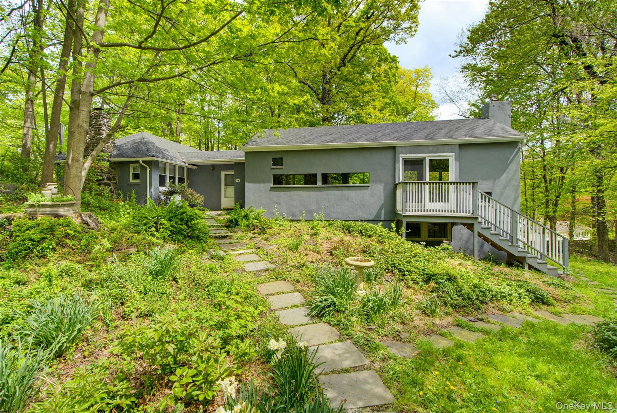 Sought-after Mount Airy location in the village of Croton-on-Hudson.  Private 3/4 acre lot with beautiful park-like grounds.  This home has a wonderful floor plan featuring an open cooks kitchen to a great room with a fireplace and architectural details - vaulted beamed ceiling, wood floors and walls of windows flooding your living space with beautiful sunlight.  2 sliding door to a large deck overlooking the rear yard plus a Juliet balcony with sliding door is a perfect place to watch the nightly sunsets.   Many updates make this a turn-key home.  Basement space provides unlimited possibilities - home gym, yoga studio artist space, wine cellar.  Minutes to Croton-Harmon RR with both Metro North Express Hudson Line and Amtrak Service and preferred village resident parking automatically granted. Croton-on-Hudson is an artist-haven and cultural center with  hiking, Hudson River trail system and more.