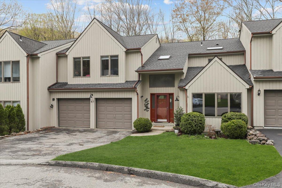 Perfectly situated on a quiet cul-de-sac in the sought-after Green Briar neighborhood, this beautiful townhome offers a relaxed and convenient lifestyle surrounded by nature. The dramatic great room with fireplace and custom shelves, features vaulted ceilings and oversized windows that fill the space with natural light while showcasing peaceful wooded views. Sliders from both the great room and spacious kitchen open to a large deck overlooking serene natural surroundings — the perfect setting for morning coffee or outdoor entertaining.The open living and dining areas at the front of the home provide inviting spaces for gatherings both large and small, while the thoughtfully designed mudroom area and adjoining laundry room, conveniently located just off the two-car garage, add everyday ease and functionality to the main level. Upstairs, beyond the balcony overlooking the first floor, the expansive primary suite serves as a peaceful retreat featuring two walk-in closets — including one with space for a dressing area  — along with a stunning spa-like bath complete with a freestanding soaking tub and separate shower. Warm wood floors continue through both the primary suite and upper hallway. Two additional bedrooms, each with generous closet space, share a full hall bath.The walkout finished lower level offers exceptional flexibility with a full bath, summer kitchen, recreation areas, and abundant storage, making it ideal for multi-generational living, guests, a home office, gym, or play space. Thoughtful updates and improvements include a new HVAC heat pump system (2024), above-ground oil tank (2025), roof (2017), exterior painting, and generator hookup for added peace of mind.