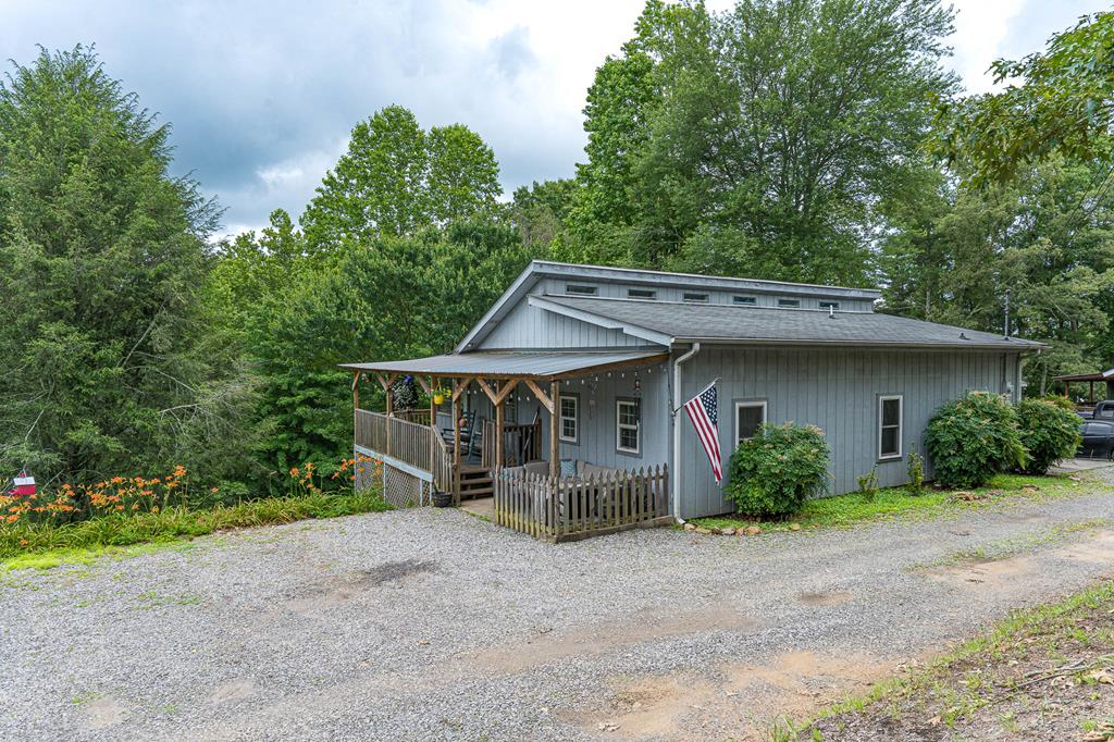Welcome Home to this beautifully maintained 3-bedroom, 2-bathroom home offering just over 1,500 square feet of comfortable living space, ideally situated just minutes from Murphy, Blue Ridge, and Blairsville. Enjoy easy access to outdoor adventures like river rafting, hiking, and mountain exploring, while still being close to charming small towns with dining, shopping, and more. Inside, the home features an open, airy layout with a large living area perfect for relaxing or entertaining. The kitchen is equipped with sleek stainless steel appliances, making meal prep a breeze. Each of the three spacious bedrooms offers plenty of room for family, guests, or a home office setup. High-speed fiber optic internet provides fast, reliable connectivity for work or play. Step outside to a welcoming outdoor porch—perfect for morning coffee or evening gatherings—and enjoy the usable yard space for gardening, pets, or simply soaking in the peaceful surroundings. Additional basement storage gives you room to tuck away seasonal items, tools, or gear for your outdoor hobbies. Whether you're looking for a full-time residence or a mountain retreat, this home combines comfort, convenience, and outdoor charm in one inviting package.