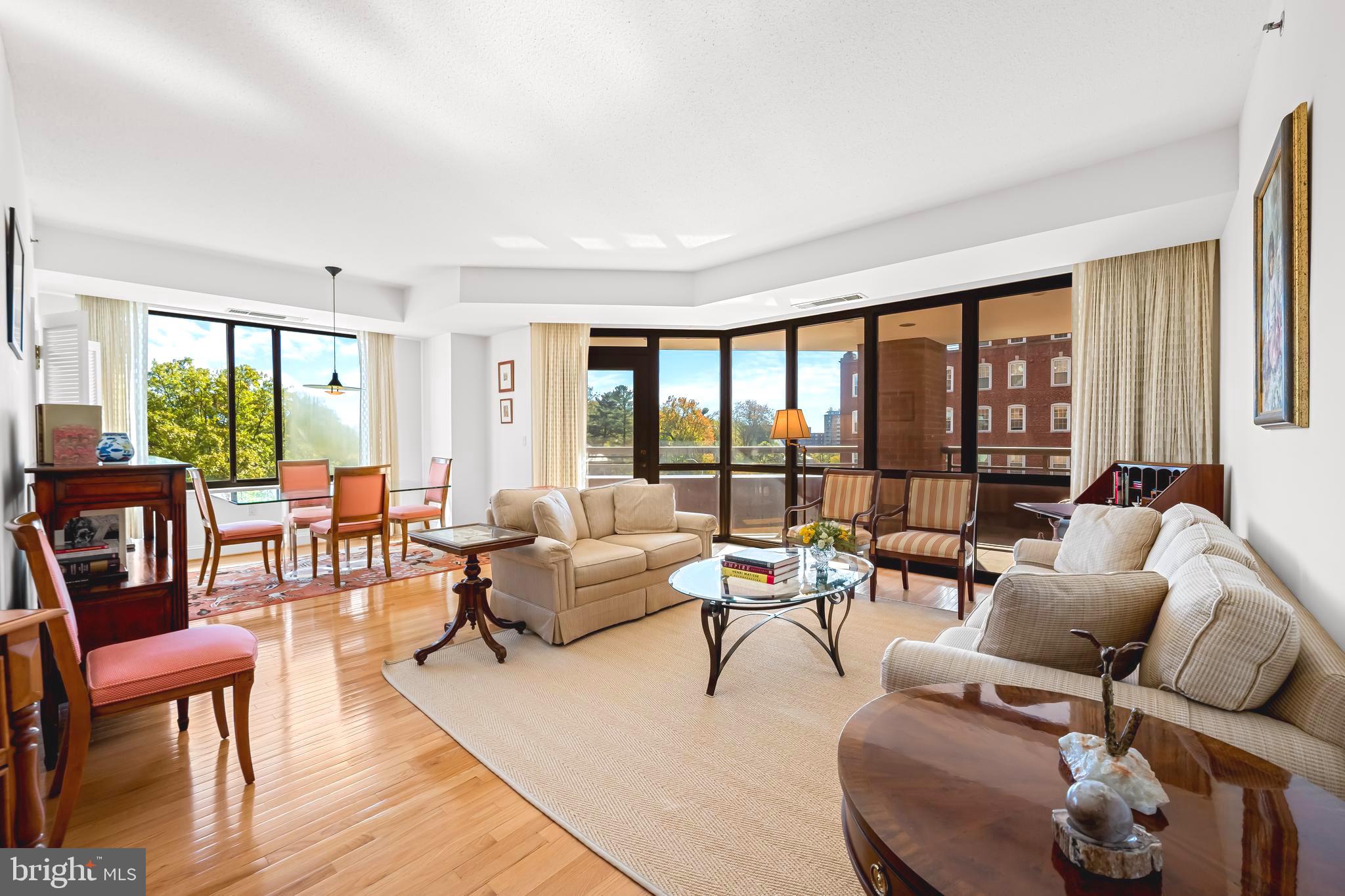 Come Visit and Fall in Love! Welcome to this turn-key, light-filled condominium featuring 2 spacious bedrooms and 2.5 baths in The St. James—an exclusive, full-service building just steps from Johns Hopkins University in the heart of charming Guilford. As you enter, you’ll immediately feel the warmth and elegance of this southern facing corner unit, where an inviting foyer with a convenient coat closet and powder room leads to a gracious open living and dining area framed by walls of windows and wonderful views. Step outside to enjoy your own private, wraparound balcony—perfect for morning coffee or evening relaxation. The updated kitchen offers granite countertops, recessed lights and stainless steel appliances. The spacious primary suite includes a large walk-in closet with a dressing area, double vanity, and an en-suite bath featuring a jetted tub and separate shower. The second bedroom also includes its own full bath with a tub/shower combination. A full-size washer and dryer are located in the large utility room, which also provides additional storage space. Building amenities include a doorman, front desk reception, outdoor pool, fitness center, library, meeting room, one garage parking space, one covered carport space, and an additional storage unit. Conveniently located near JHU, the Baltimore Museum of Art, restaurants, cafés, and more. Pet-friendly building—bring your dog or cat!