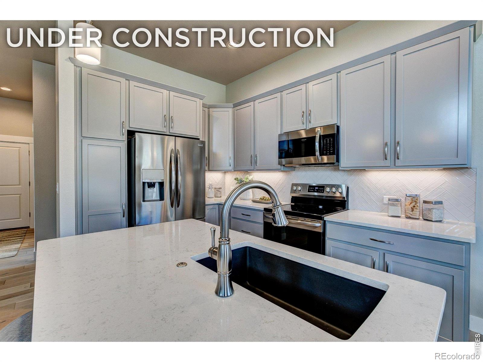 ASK ABOUT CURRENT LENDER OR CASH INCENTIVES. New construction townhome by Landmark Homes in Longmont CO. Highlands at Fox Hill. The Addison 2 offers 1,943 SF finished, 3 bed/2 bath, & 2-car attached garage. Craftsman exterior w/ fenced front porch, main-floor primary bedroom, oversized loft flex space & full unfinished basement ideal for customization, storage or future equity. Luxury finishes include quartz counters, stainless appliances, tile surrounds, tile floors in baths & laundry, tankless water heater & high-efficiency furnace. Low-maintenance lifestyle. Complimentary 1-year social membership to Fox Hill Country Club included. Minutes to Main Street Longmont, St. Vrain Greenway, Union Reservoir & Fox Hill Golf Course. Easy commute to Boulder. Ideal for first-time buyers, downsizers & investors. Personalized design process included. Pre-sale & move-in ready options available. Schedule your private tour & visit our model at 255 High Point Dr G #104, Longmont CO 80504. Quality TOWNHOMES (not condos) built by Landmark Homes, Northern Colorado's leading condo and townhome builder! Completion date may vary, call 970-682-7192 for construction updates.