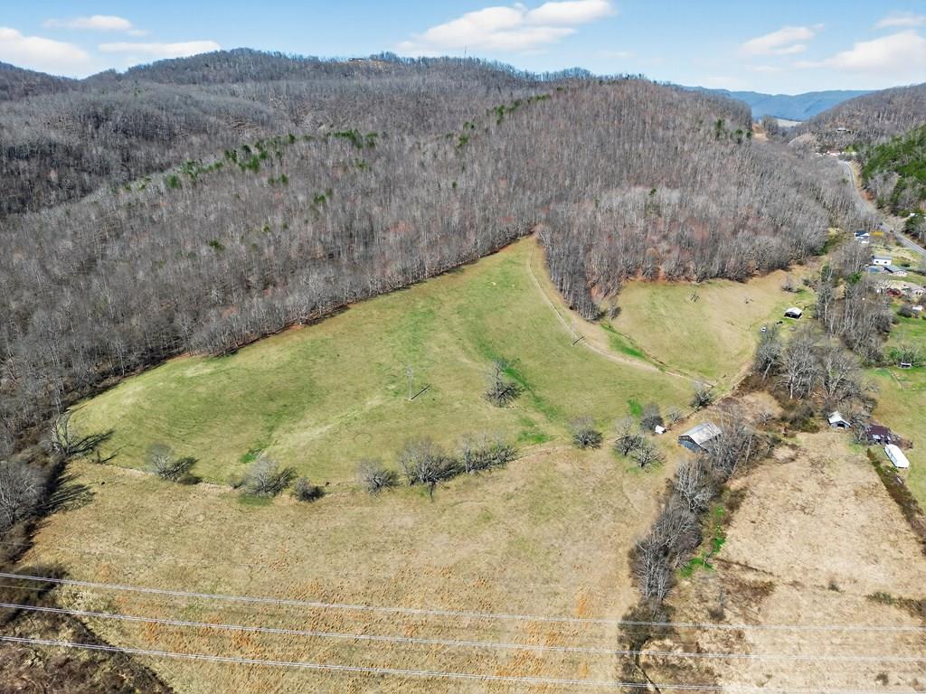 Rare Mini Farm & Multi-Purpose Land on Highway 107 – Chilhowie, VA  Discover approximately 31 acres of beautiful Southwest Virginia countryside with endless possibilities. This rare property offers three building sites right along Highway 107, plus 28 additional acres of gorgeous land featuring multiple potential locations to build your dream home, barn, or private retreat. Property was perc tested in 2024 and has access to electric and public water.   Enjoy majestic mountain views, a year-round running stream, abundant wildlife, and a barn already in place, making this property perfect for a mini farm, hunting property, homestead, or investment opportunity.   Conveniently located just 2.5 miles from I-81, you get the perfect balance of peaceful country living with quick access to town.  Whether you're looking to build, farm, hunt, or create a private getaway, properties like this in Chilhowie are becoming increasingly rare.  Land like this truly has it all — views, water, wildlife, and location. Don't wait to see it! It won't last long.